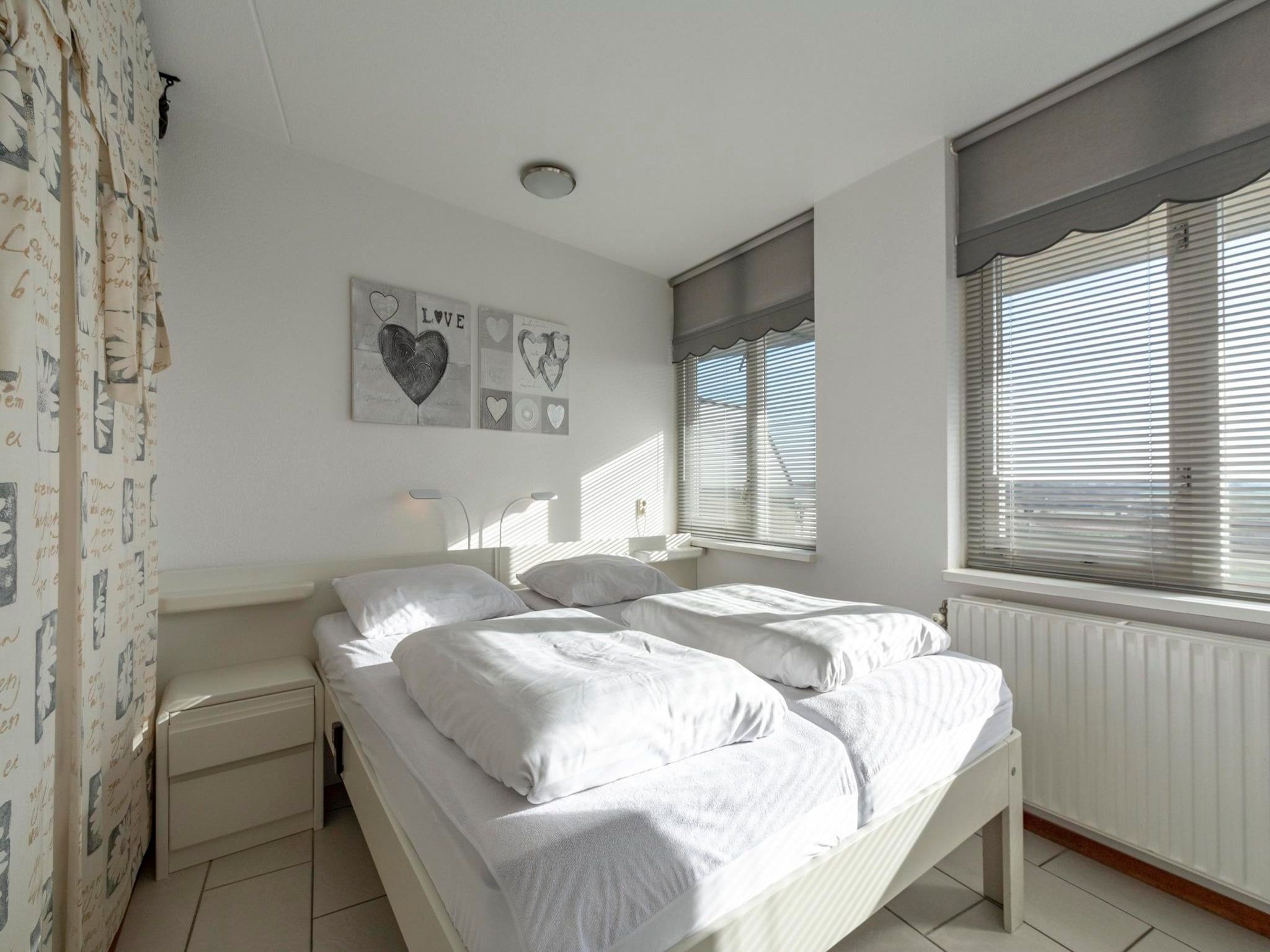 Een slaapkamer van Wijde Blick 205 in Callantsoog