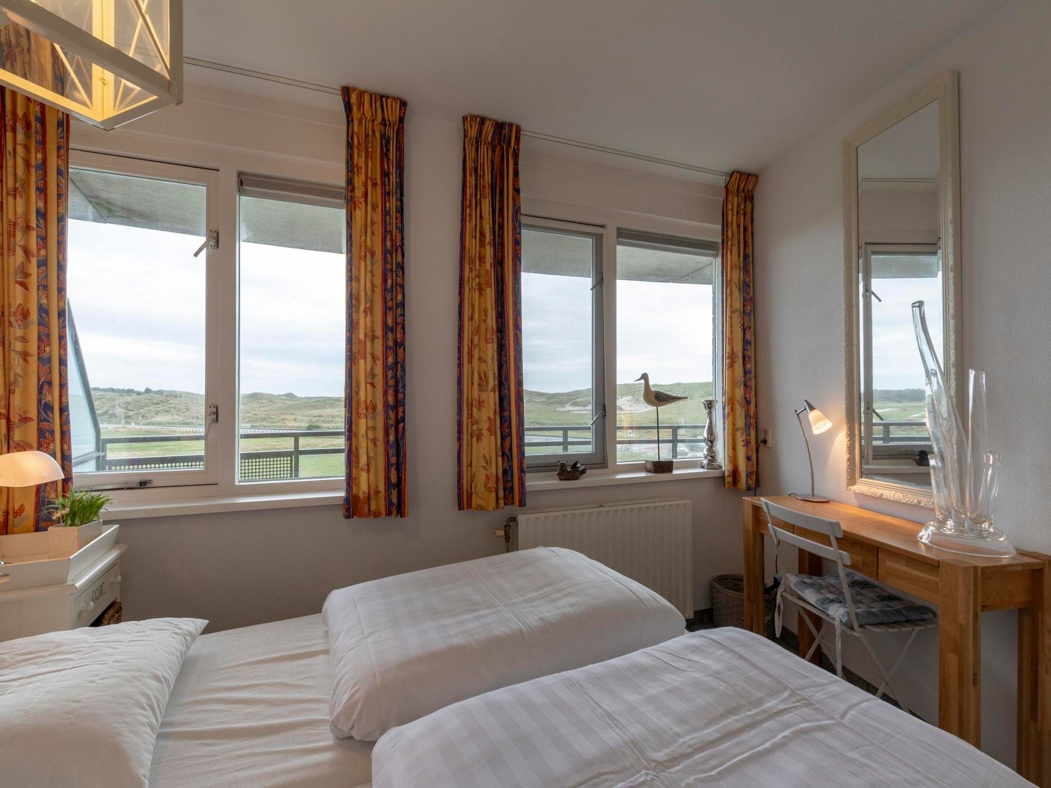 Een slaapkamer van Wijde Blick 206 in Callantsoog