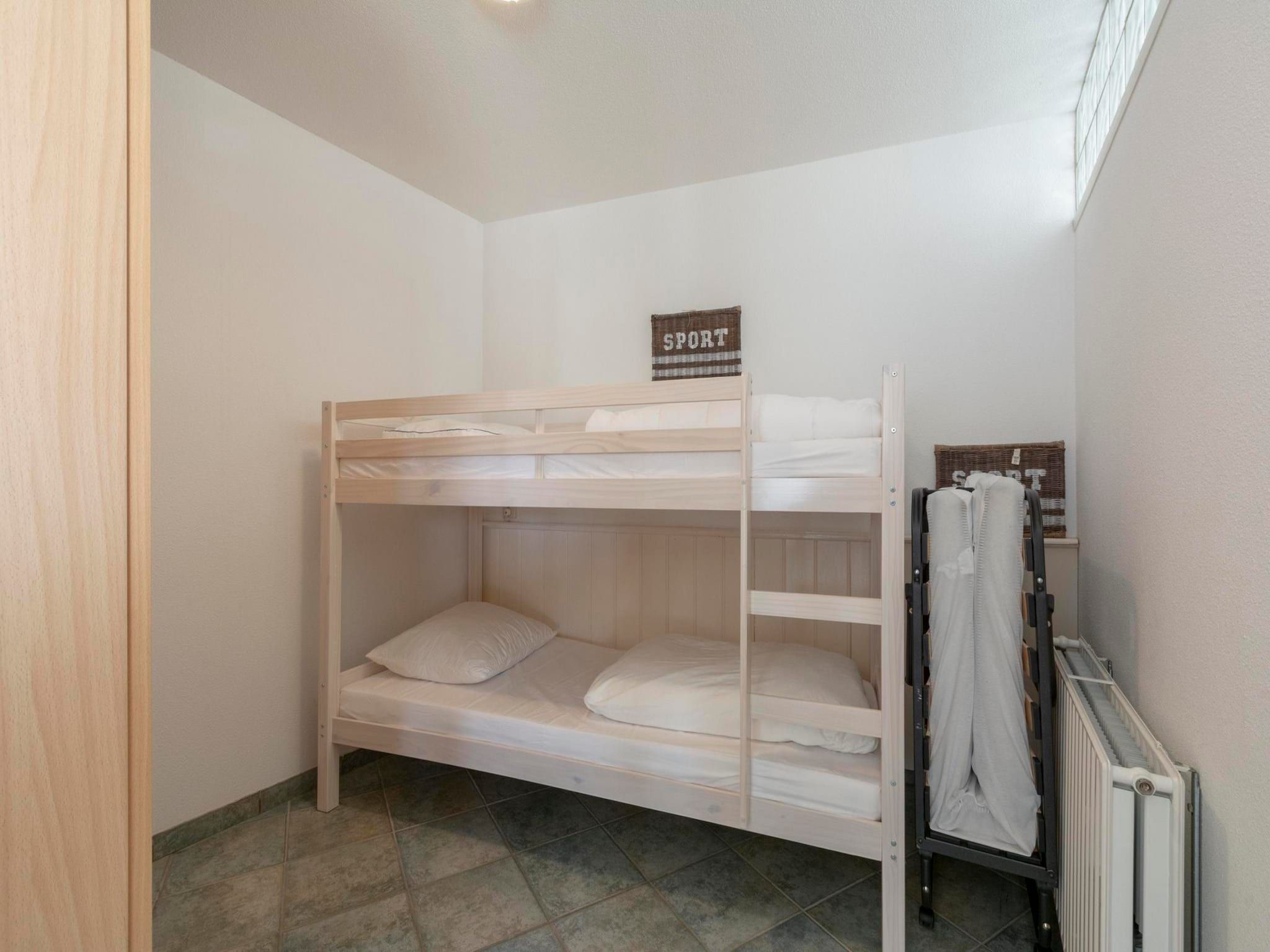 Een slaapkamer van Wijde Blick 206 in Callantsoog