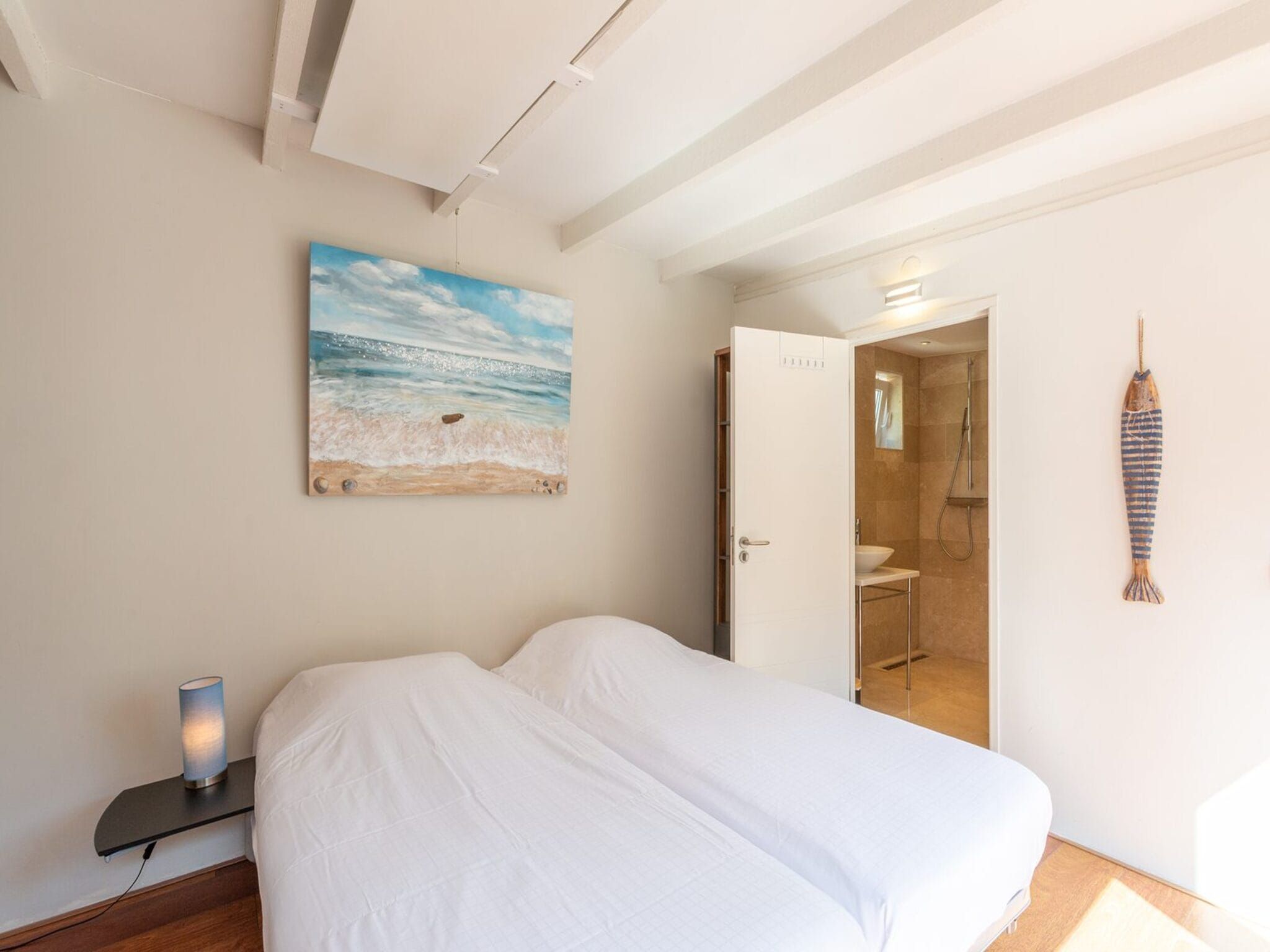 Een slaapkamer van Duinland 122 in Sint Maartenszee