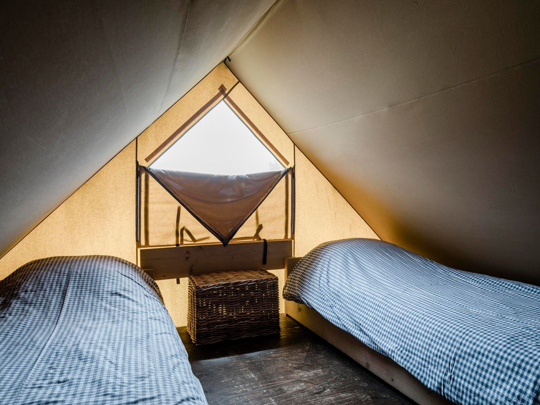 Een slaapkamer van Wood Lodge - Duynpark in Callantsoog