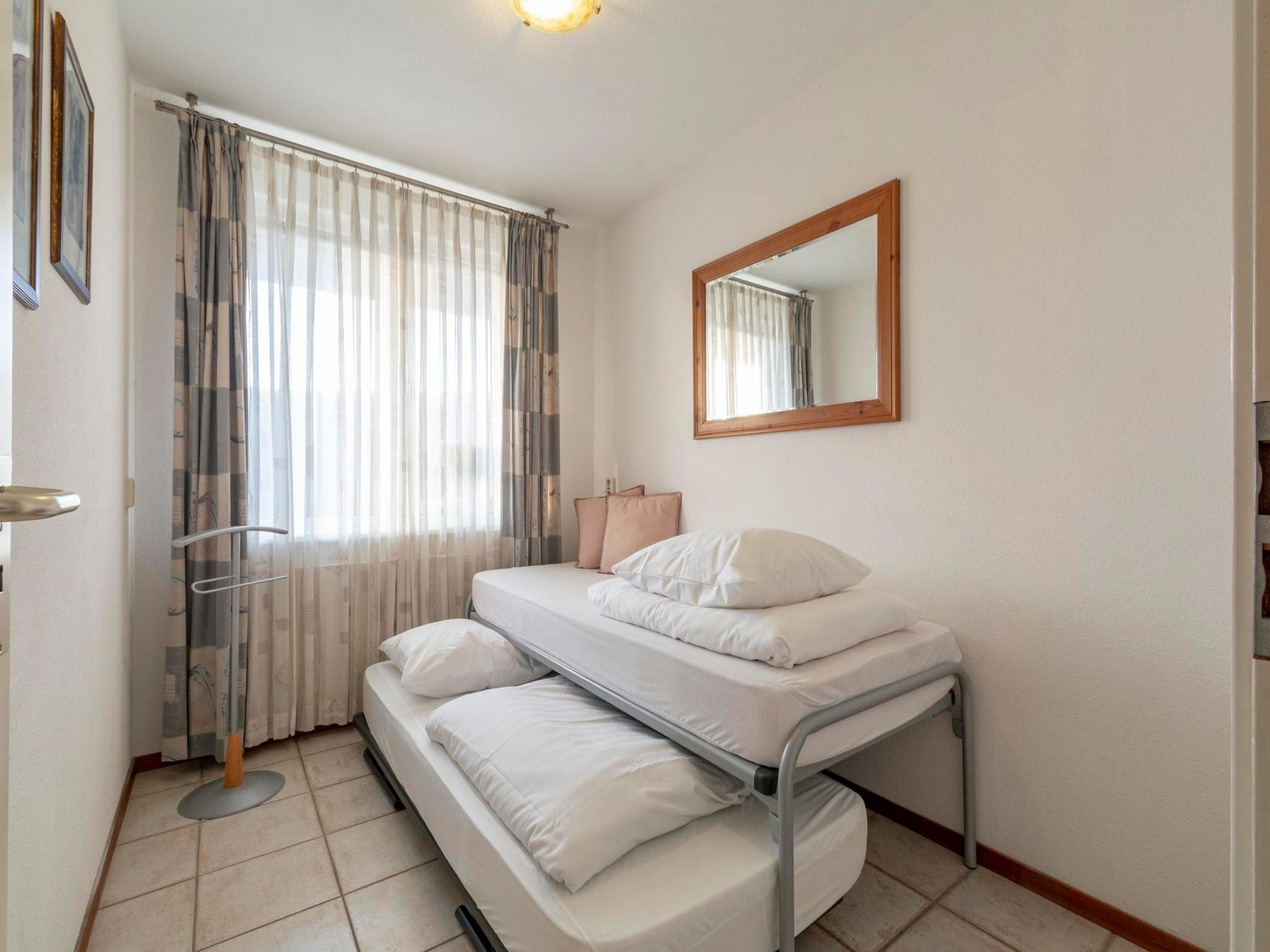 Een slaapkamer van Wijde Blick 210 in Callantsoog
