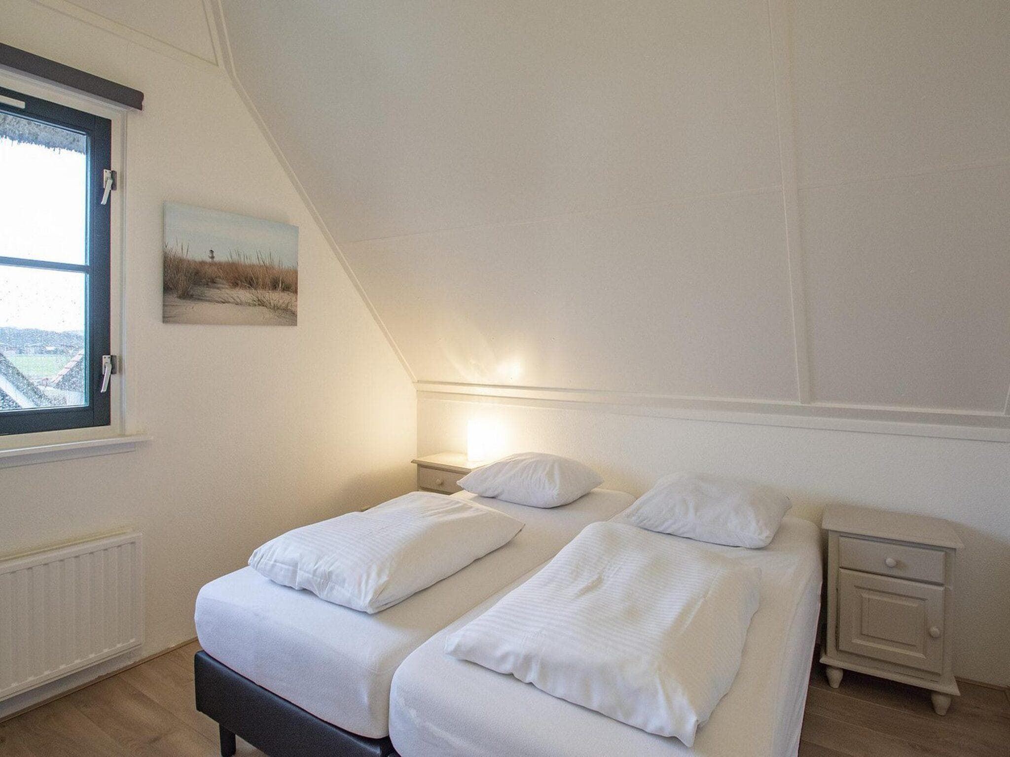 Een slaapkamer van De Buitenplaats 42 in Callantsoog