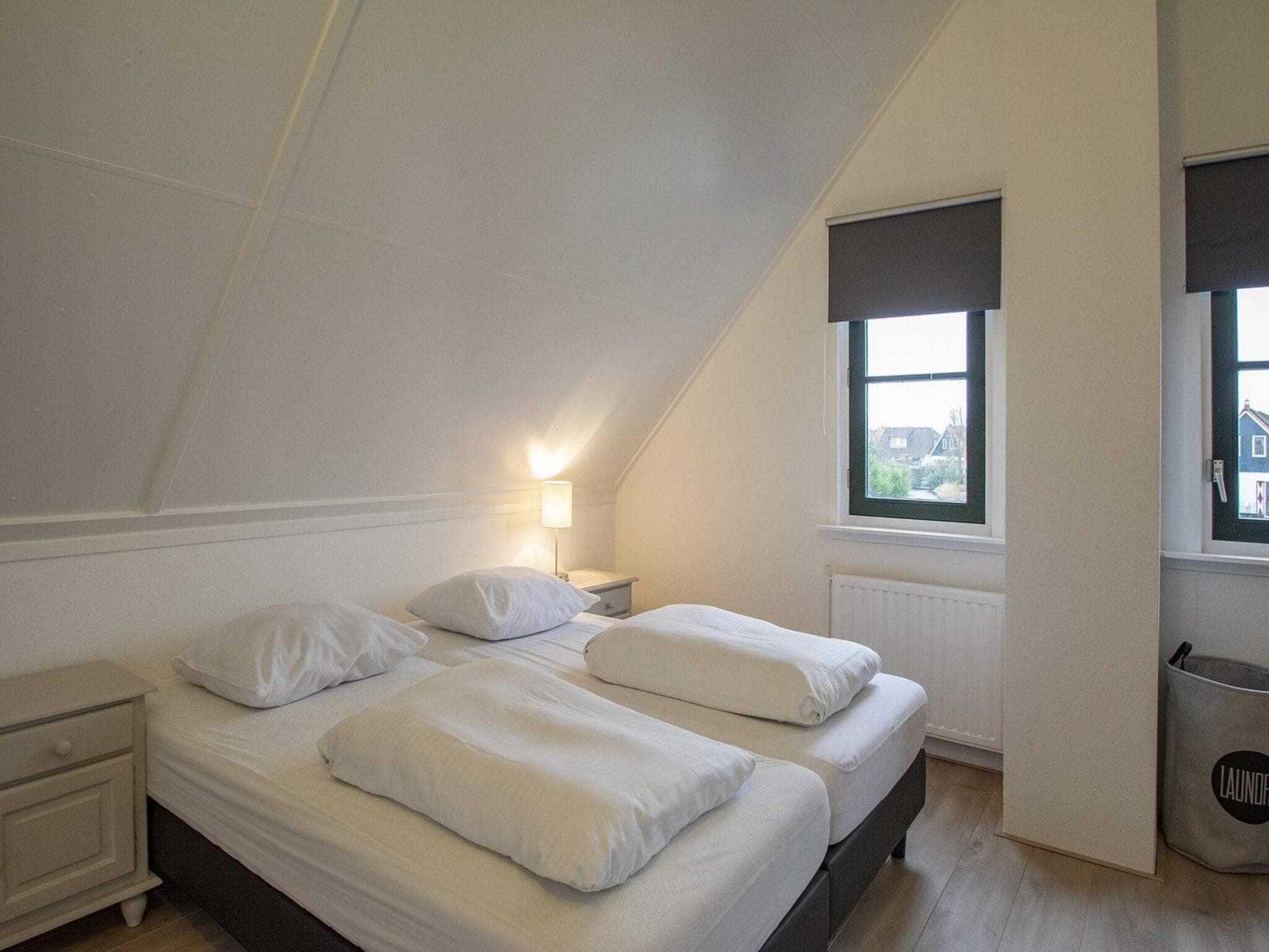 Een slaapkamer van De Buitenplaats 42 in Callantsoog