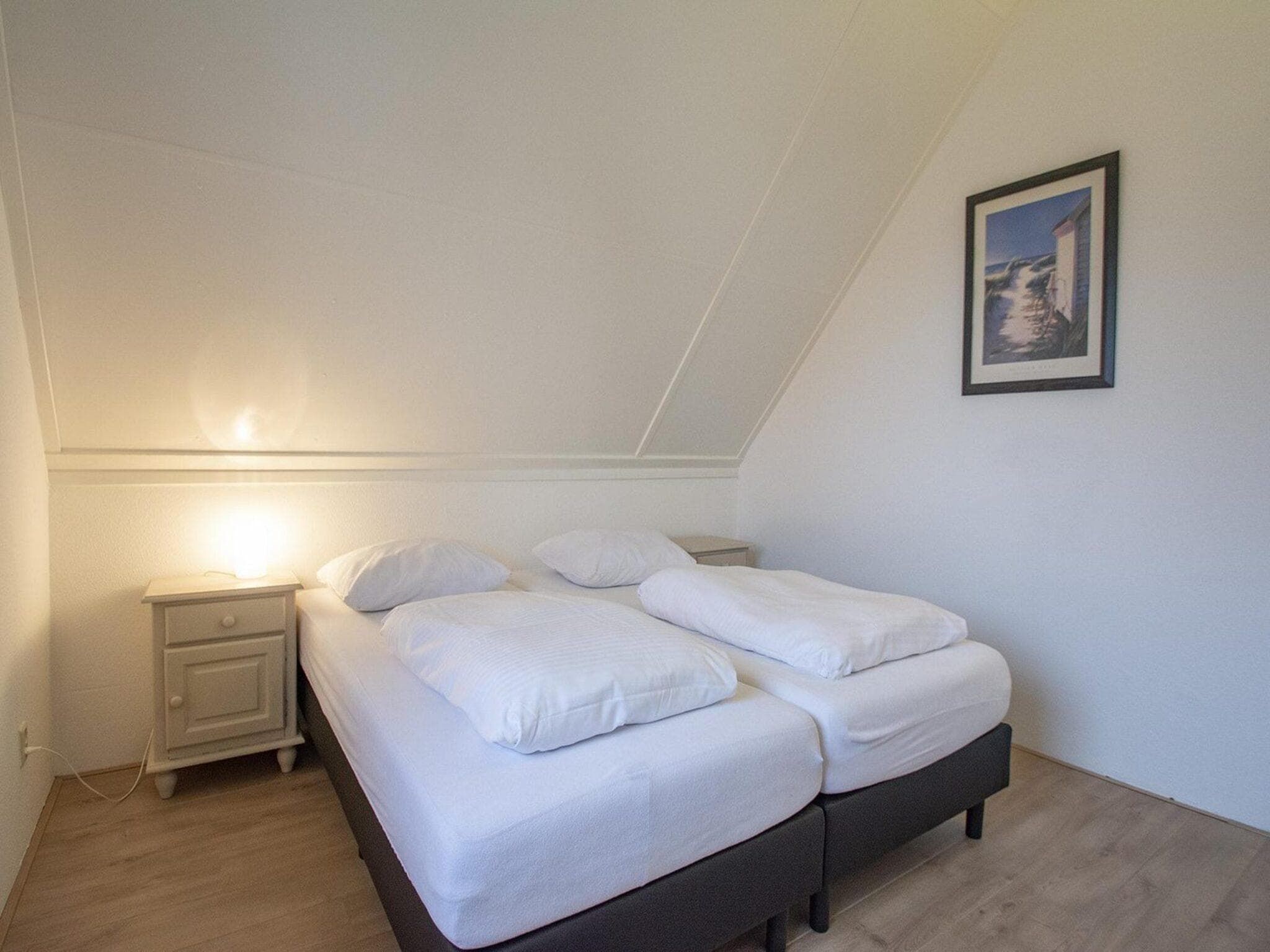 Een slaapkamer van De Buitenplaats 42 in Callantsoog