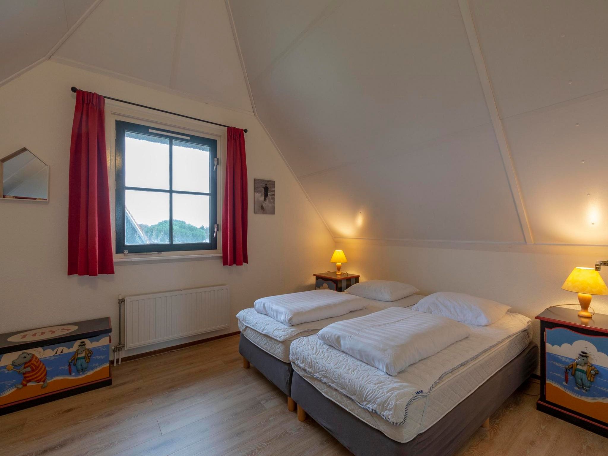 Een slaapkamer van De Buitenplaats 7 in Callantsoog