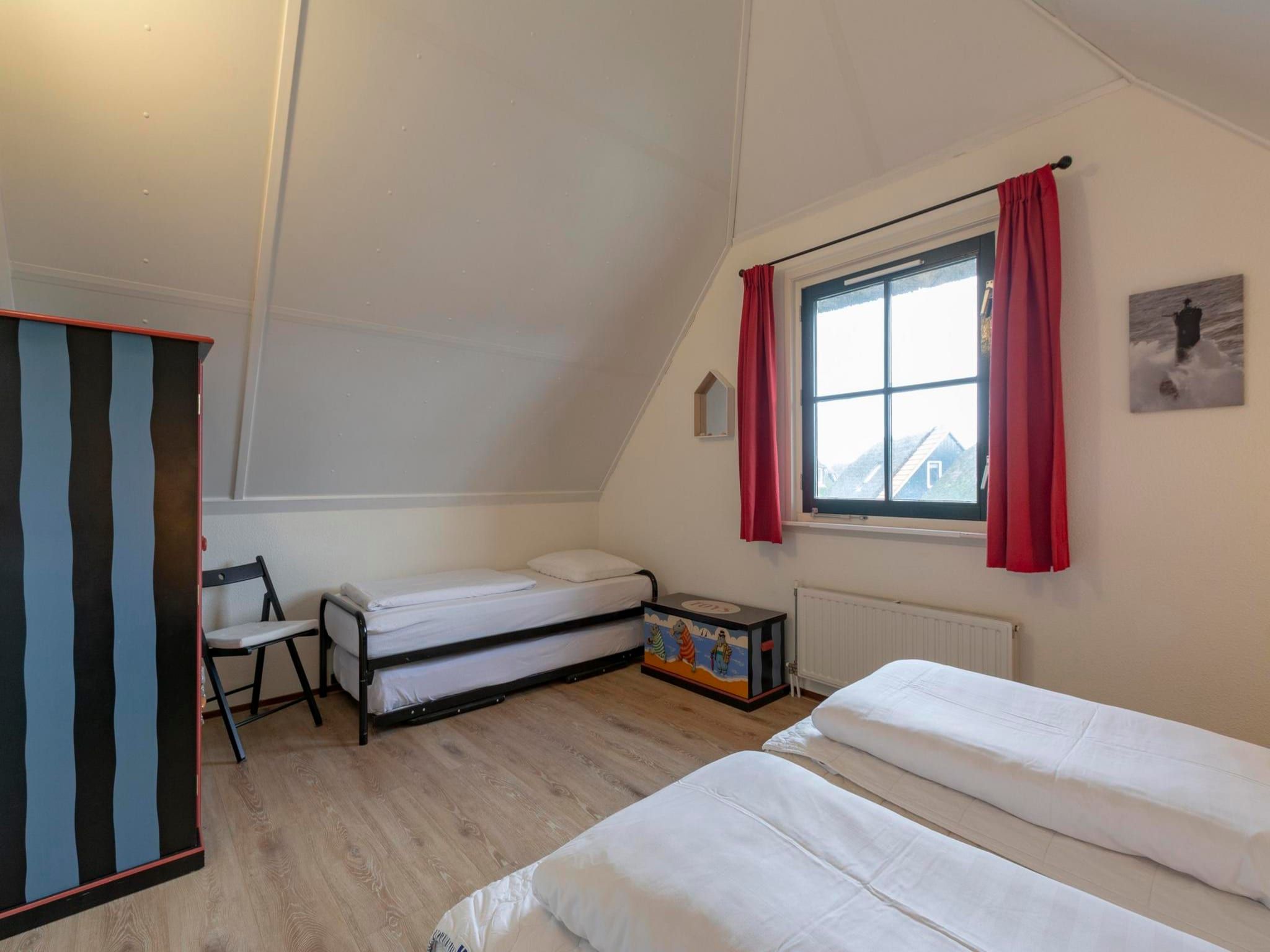 Een slaapkamer van De Buitenplaats 7 in Callantsoog