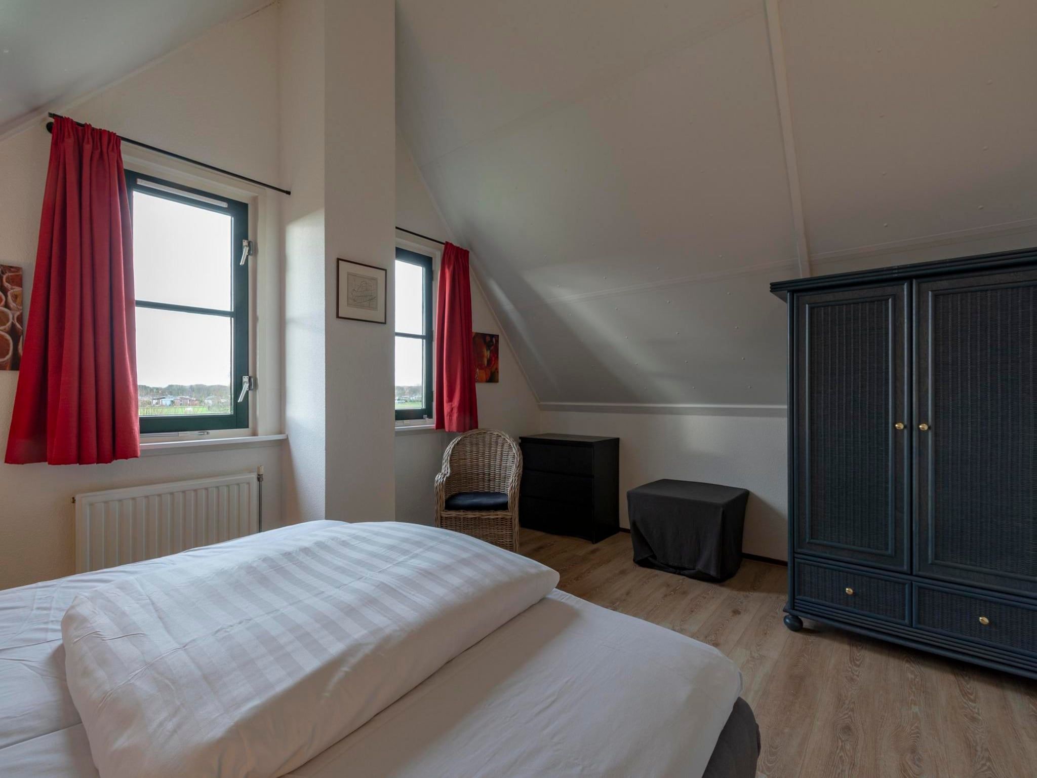 Een slaapkamer van De Buitenplaats 7 in Callantsoog