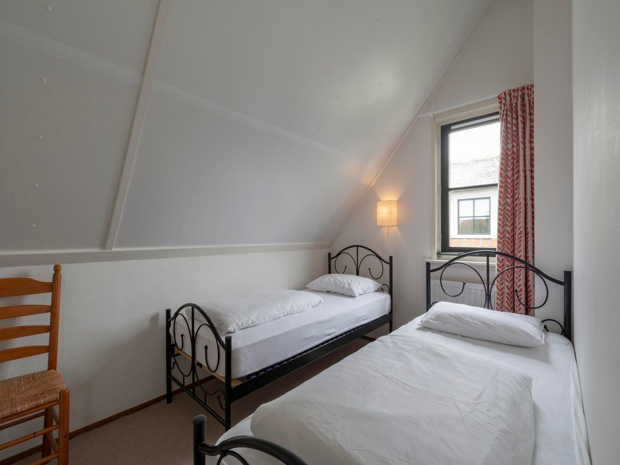Een slaapkamer van De Buitenplaats 116 in Callantsoog