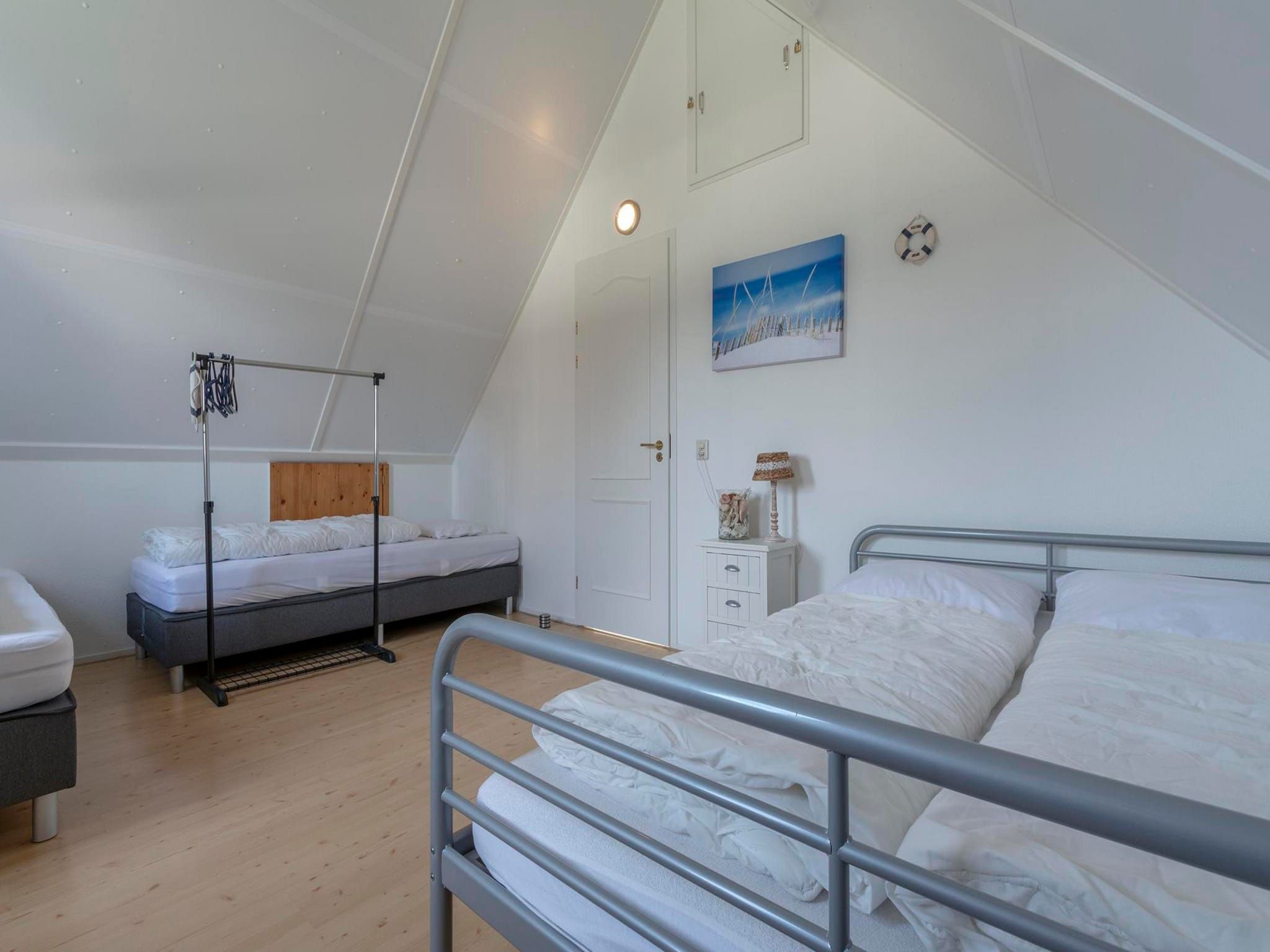 Een slaapkamer van De Buitenplaats 113 in Callantsoog