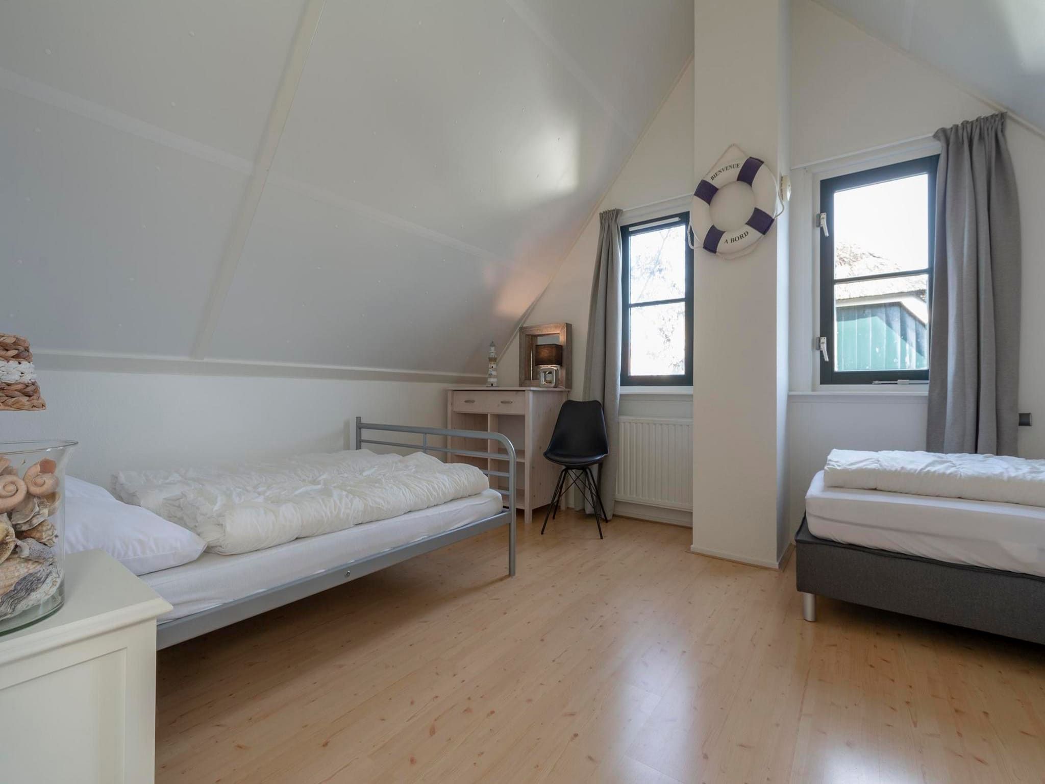 Een slaapkamer van De Buitenplaats 113 in Callantsoog