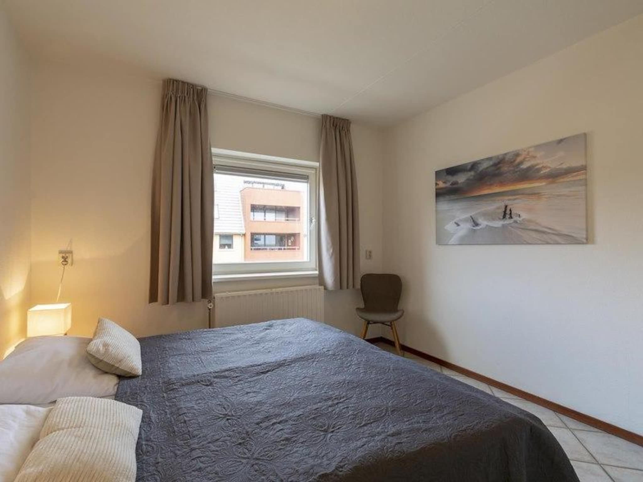Een slaapkamer van Wijde Blick 212 in Callantsoog