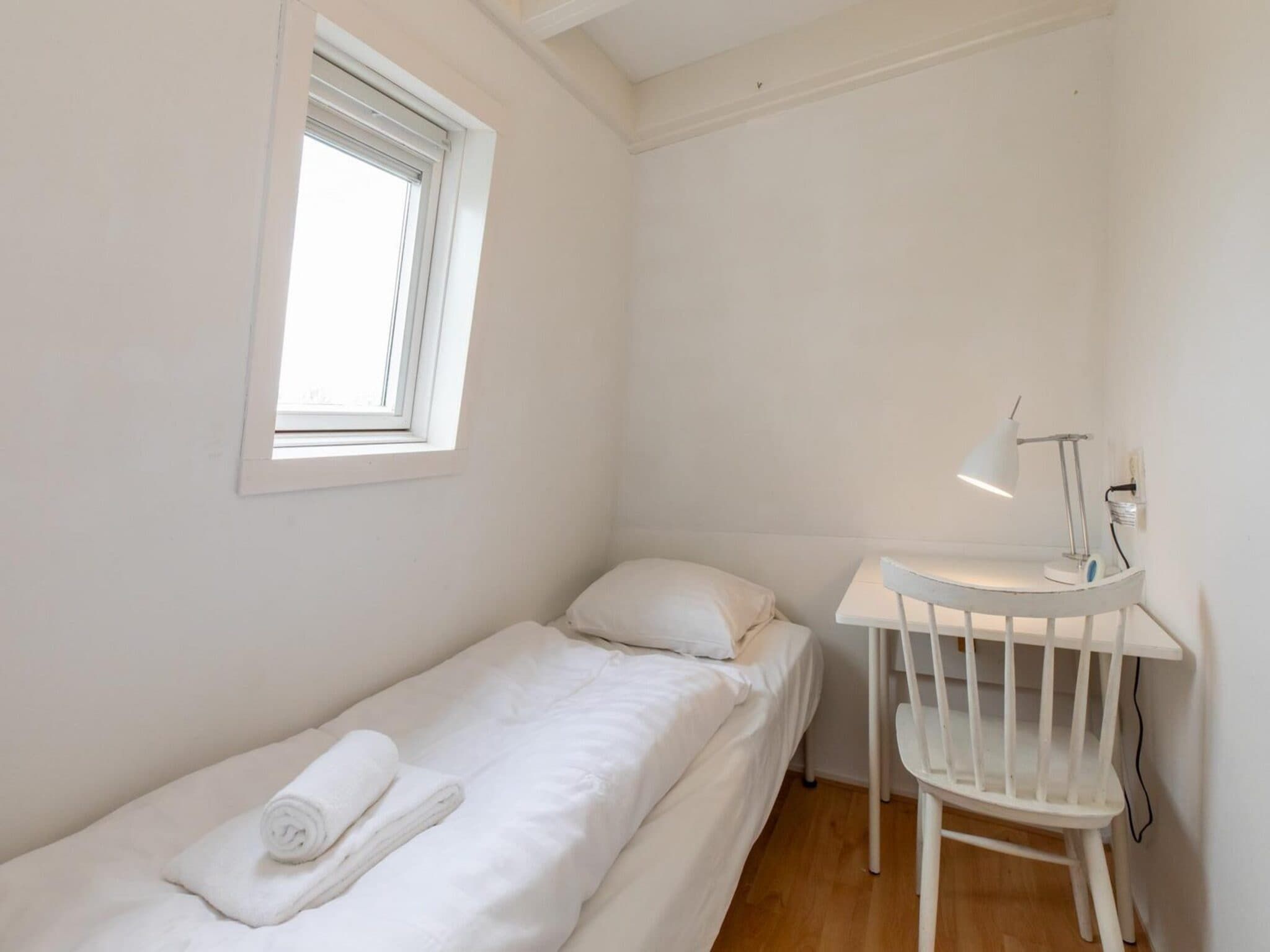 Een slaapkamer van Strandhuis Schoneveld in Breskens