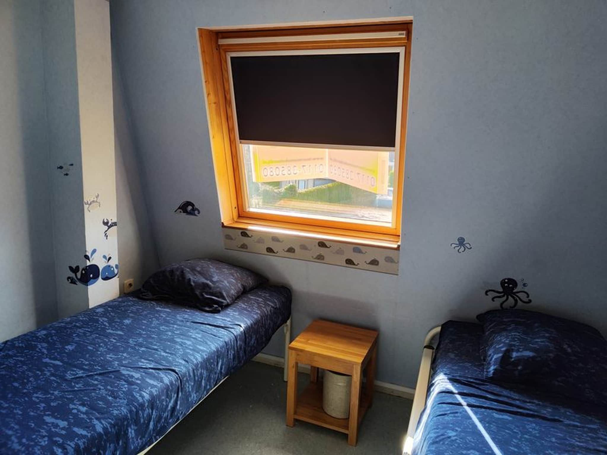 Een slaapkamer van Schoneveld 35 Zeester Breskens in Breskens