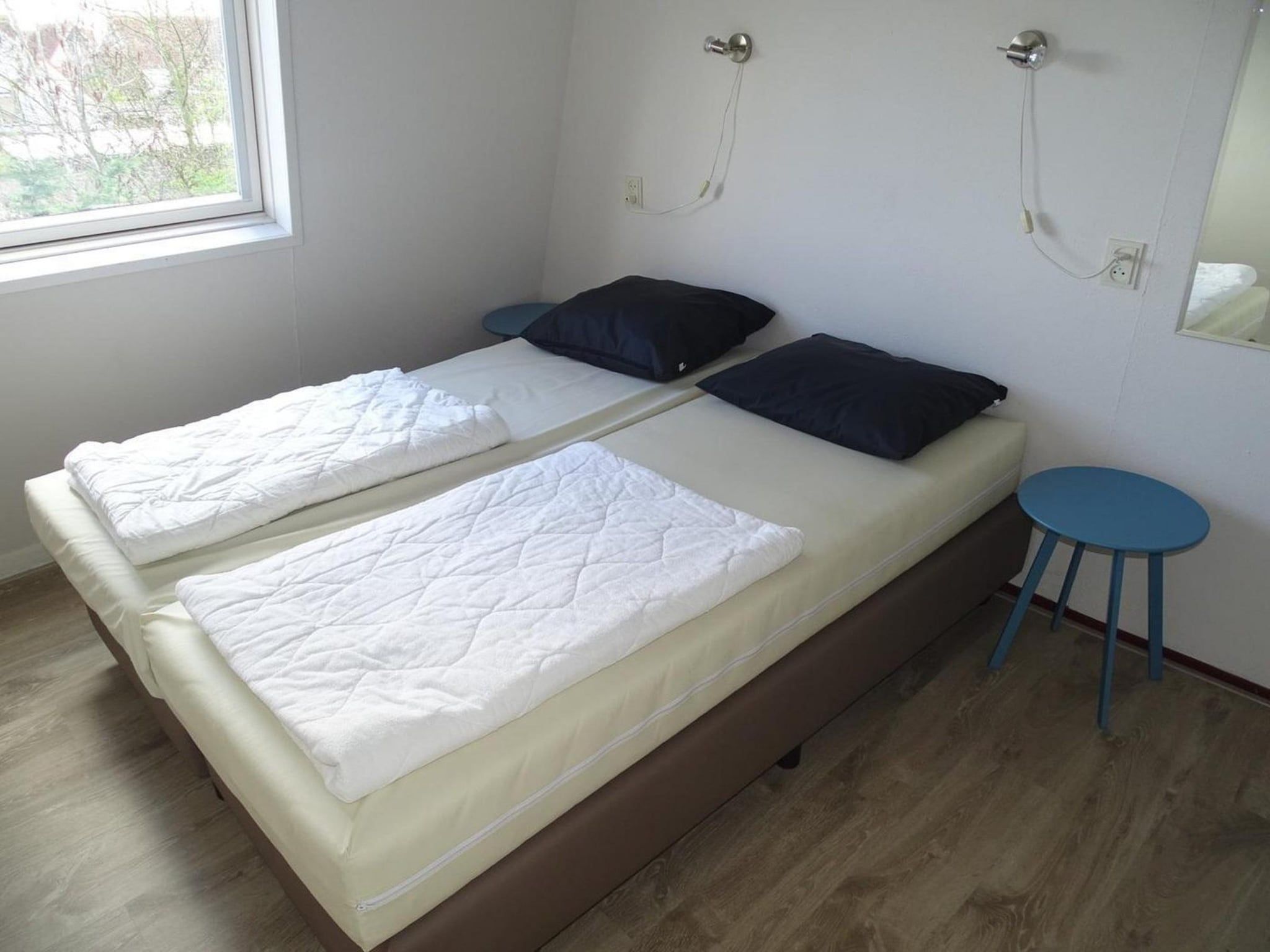 Een slaapkamer van Schoneveld 40 Zeester Breskens in Breskens