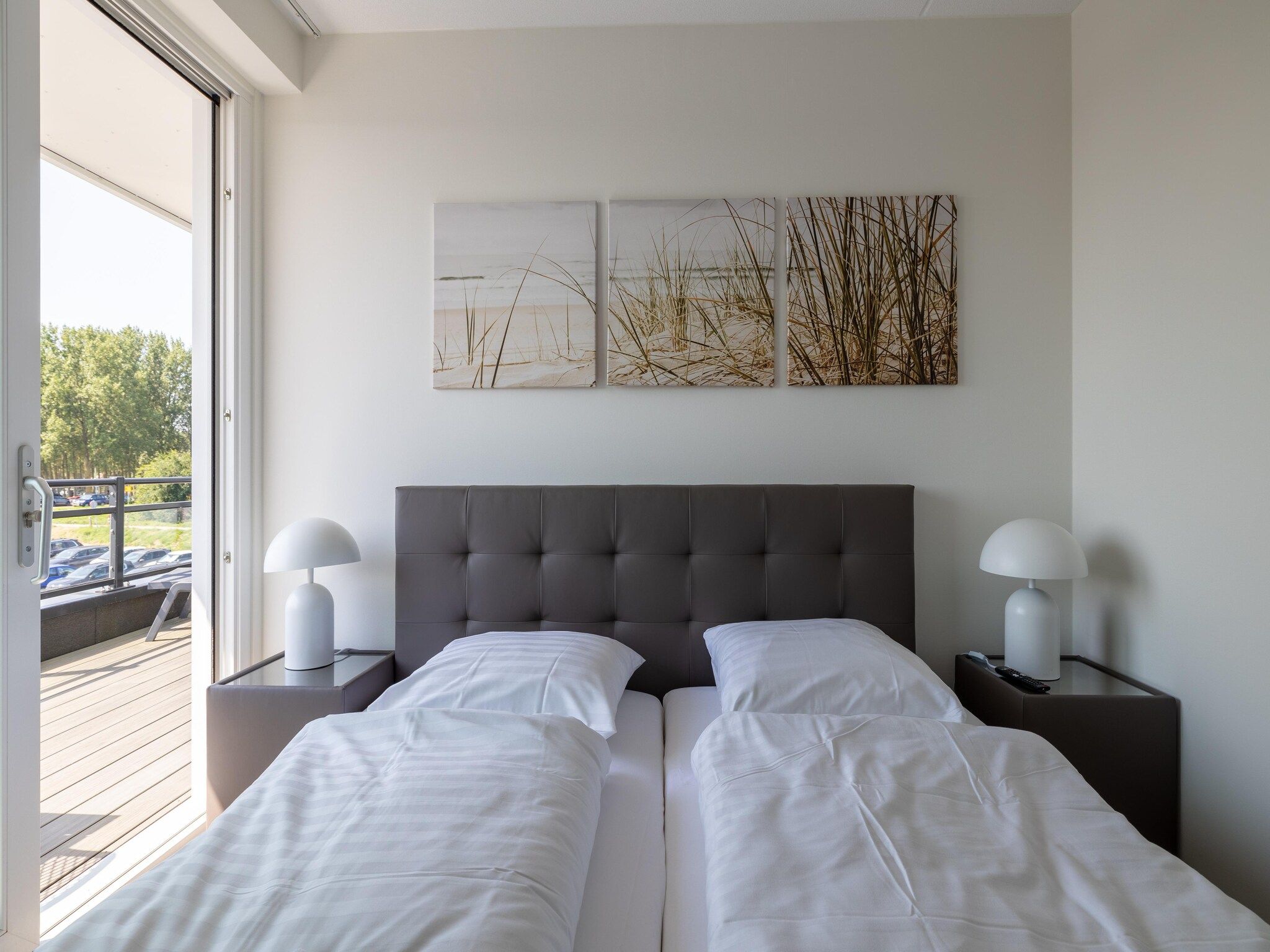 Een slaapkamer van Luxe appartement Vista Maris - Havenweg 8-46  Sint-Annaland Oosterschelde in Sint-Annaland