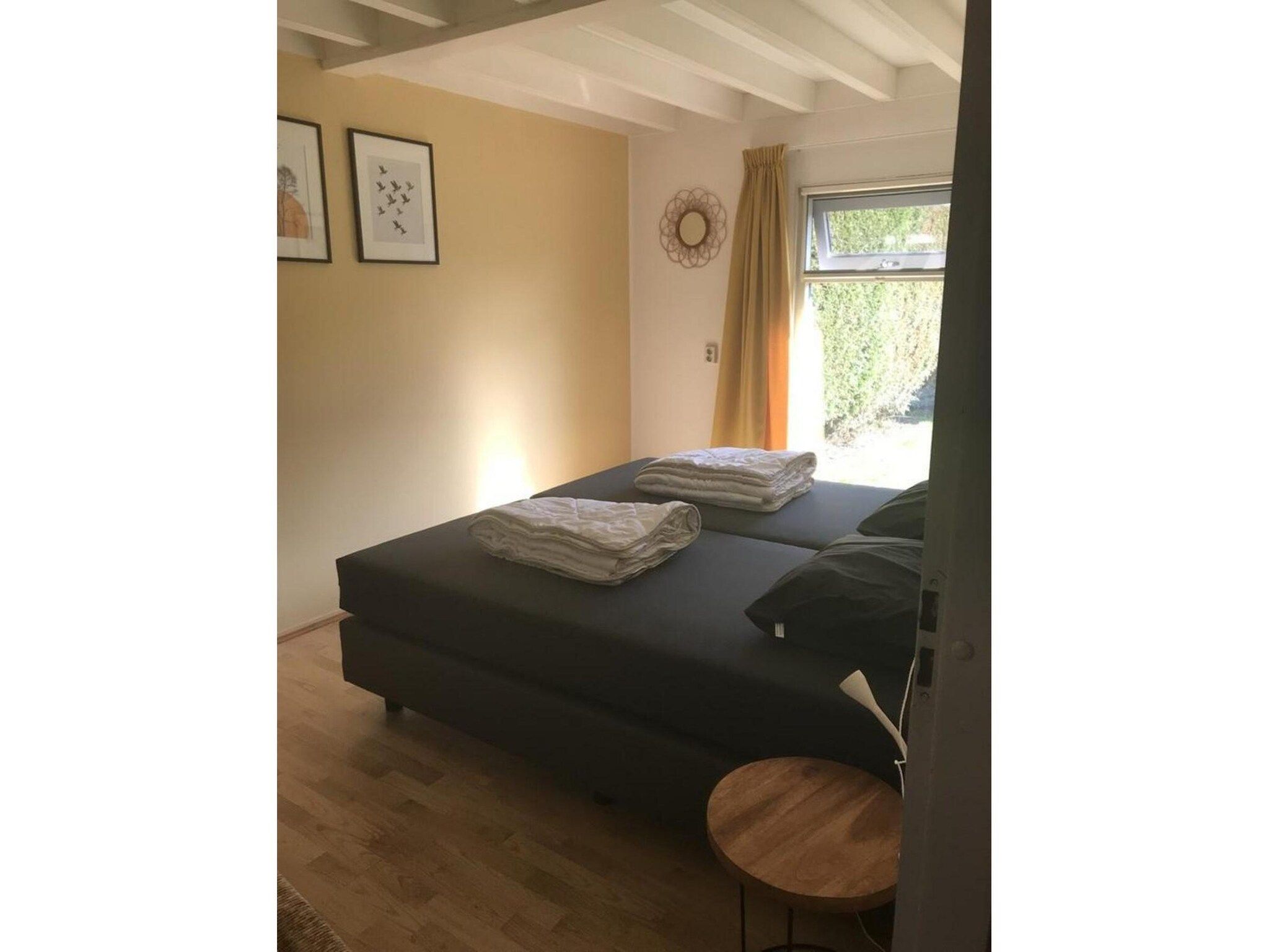 Een slaapkamer van Schoneveld 60 Zeester Breskens in Breskens