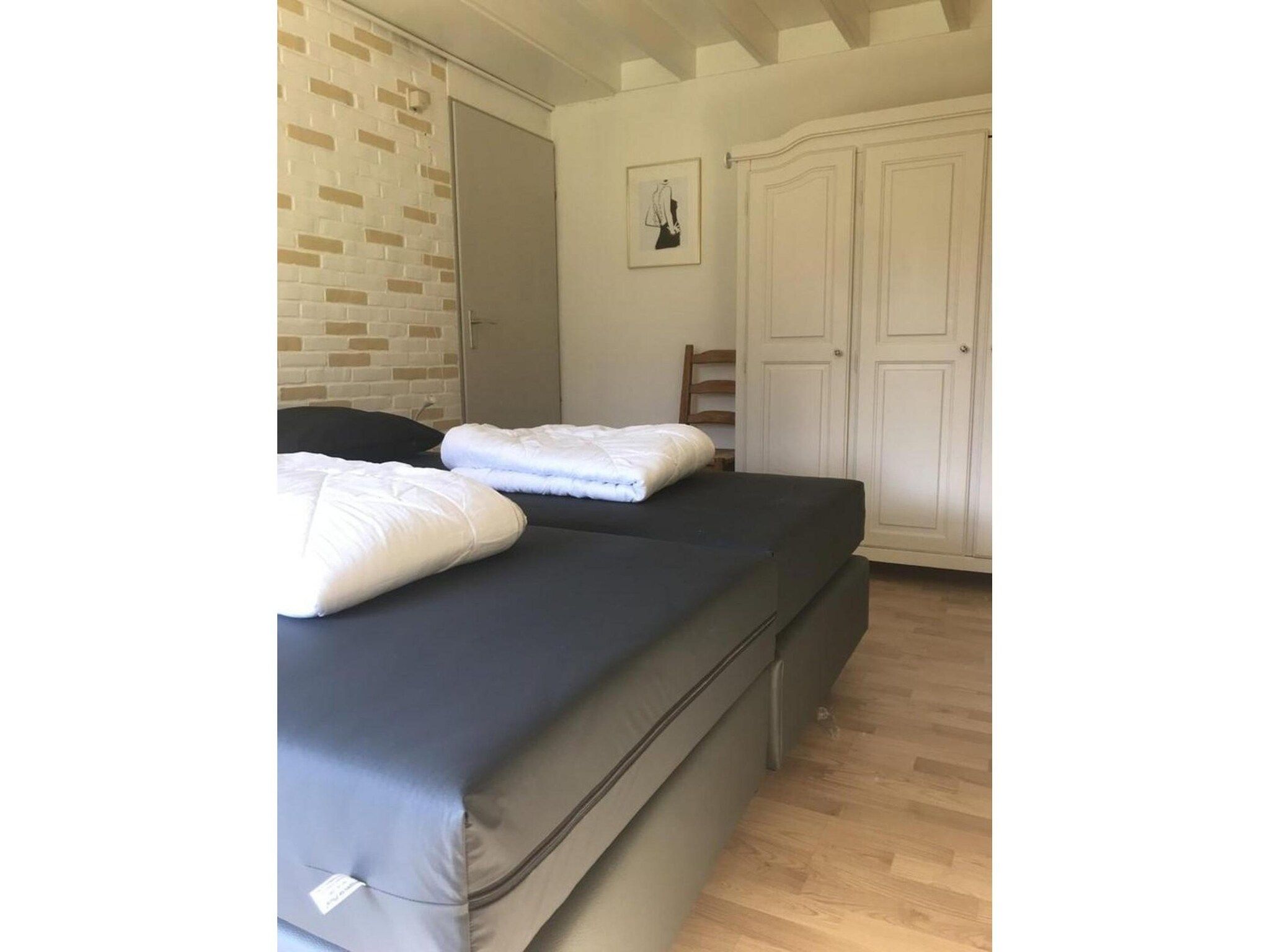 Een slaapkamer van Schoneveld 60 Zeester Breskens in Breskens