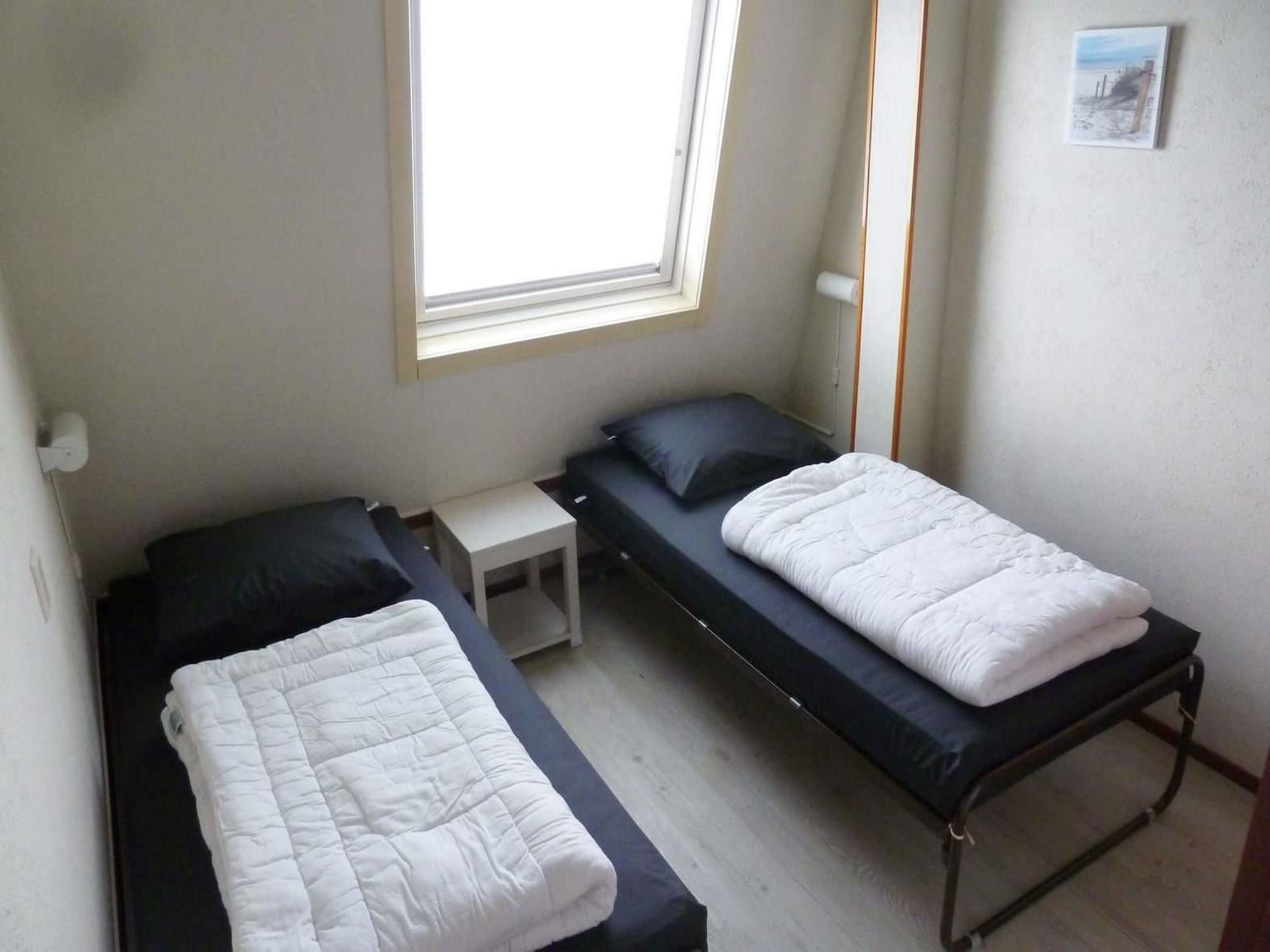 Een slaapkamer van Schoneveld 90 Zeester Breskens in Breskens