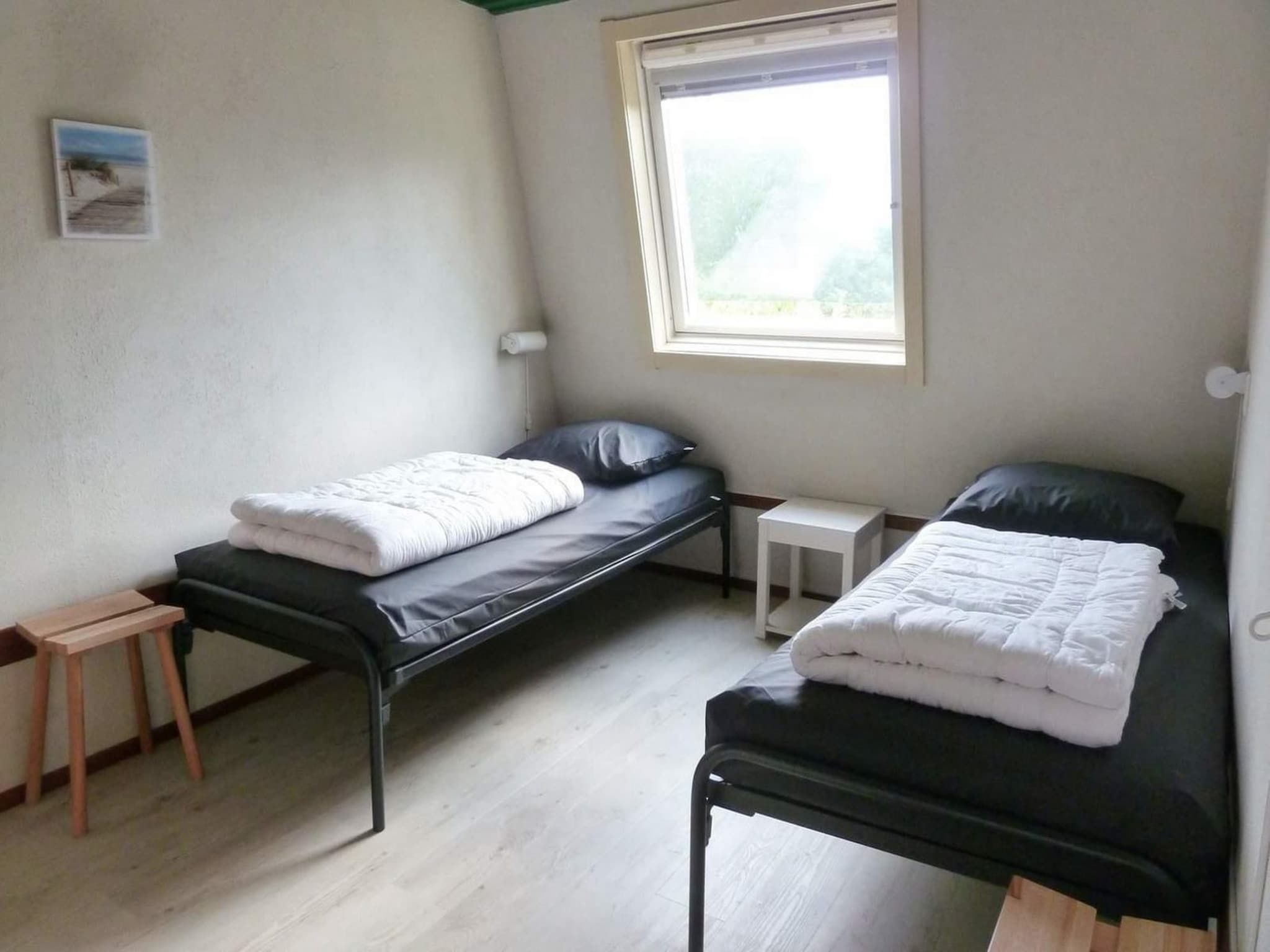 Een slaapkamer van Schoneveld 90 Zeester Breskens in Breskens