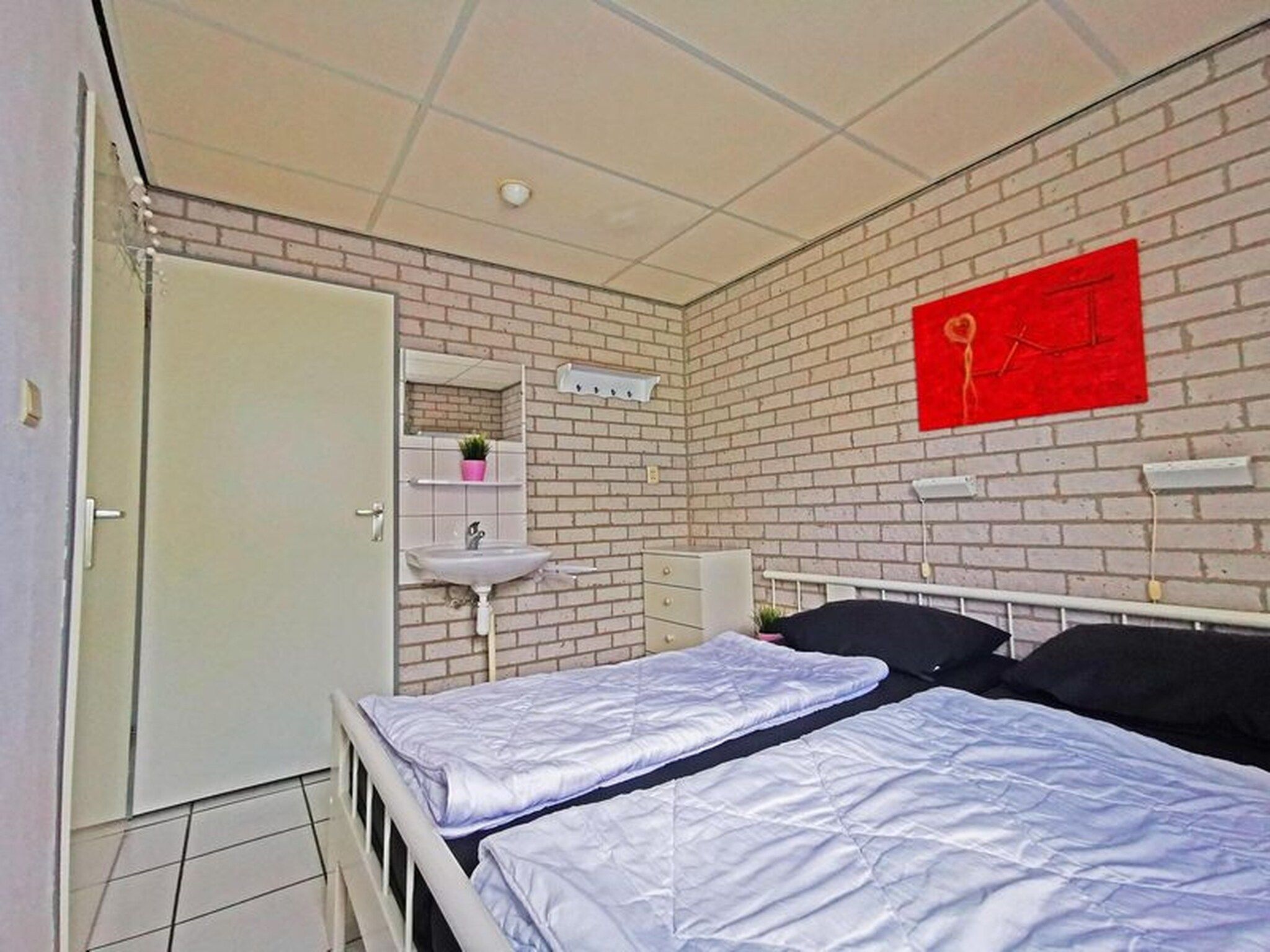 Een slaapkamer van Schoneveld 353 Strandparel Breskens in Breskens