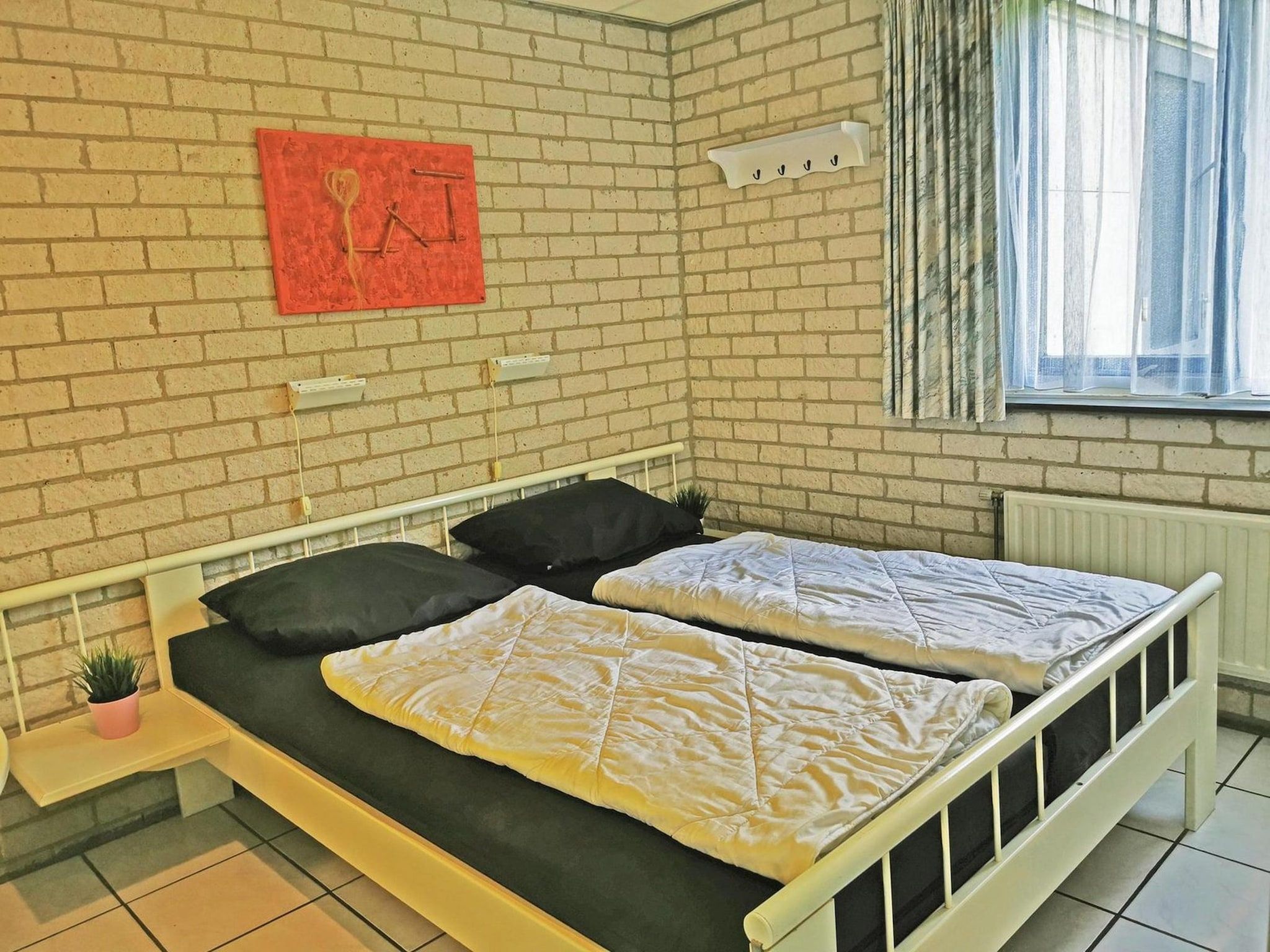 Een slaapkamer van Schoneveld 353 Strandparel Breskens in Breskens