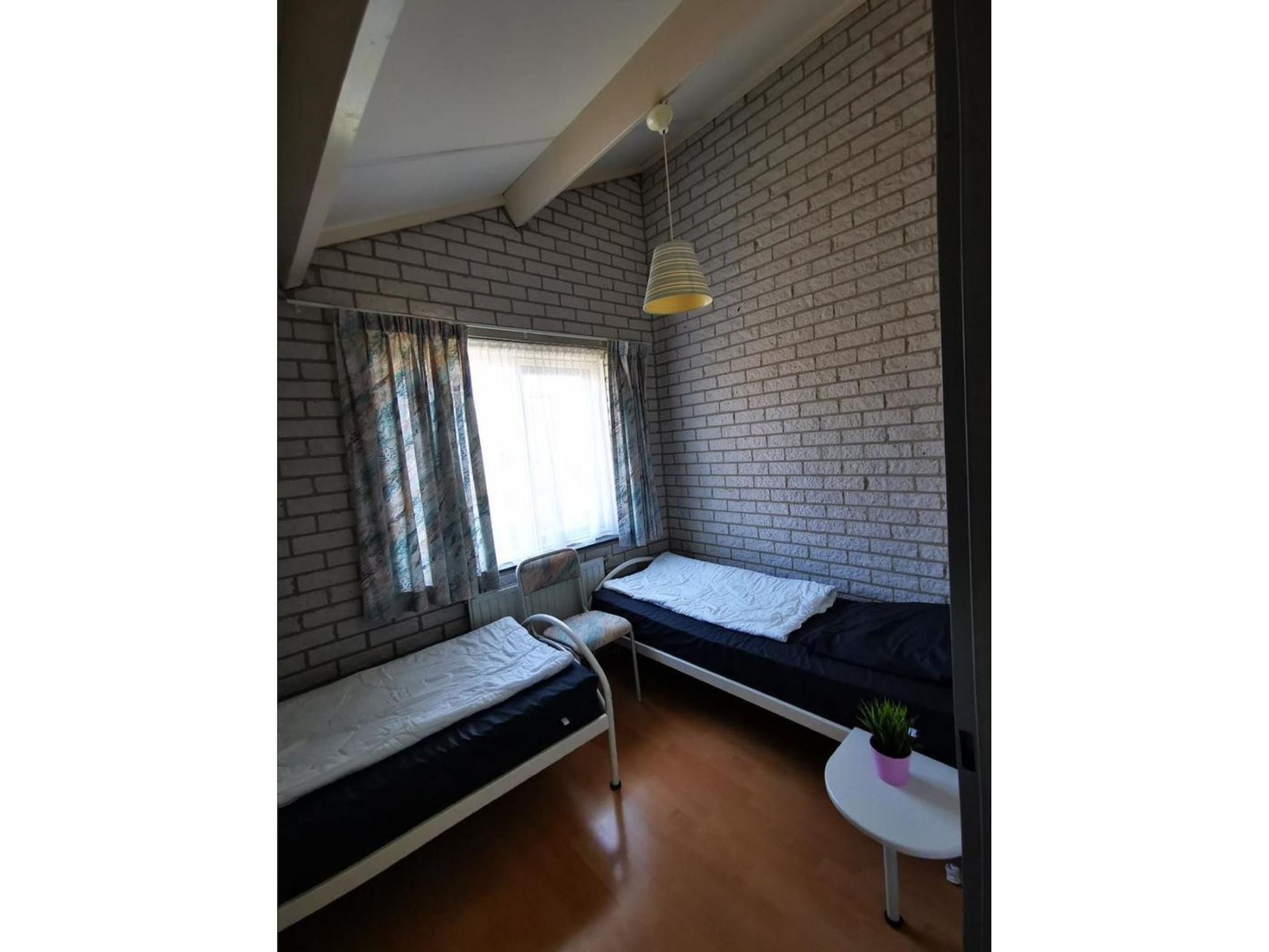 Een slaapkamer van Schoneveld 353 Strandparel Breskens in Breskens