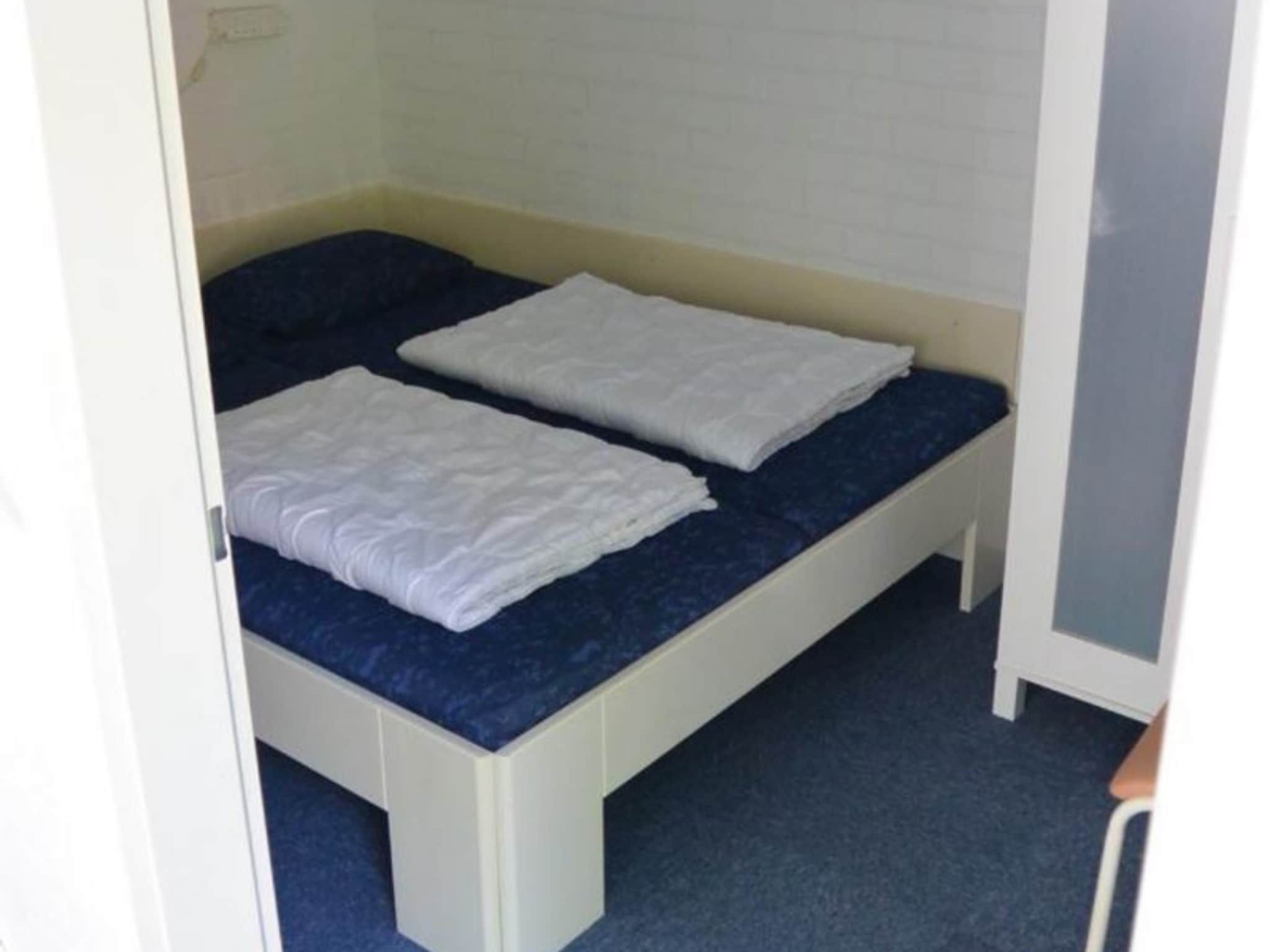 Een slaapkamer van Schoneveld 137 Duinroos Breskens in Breskens
