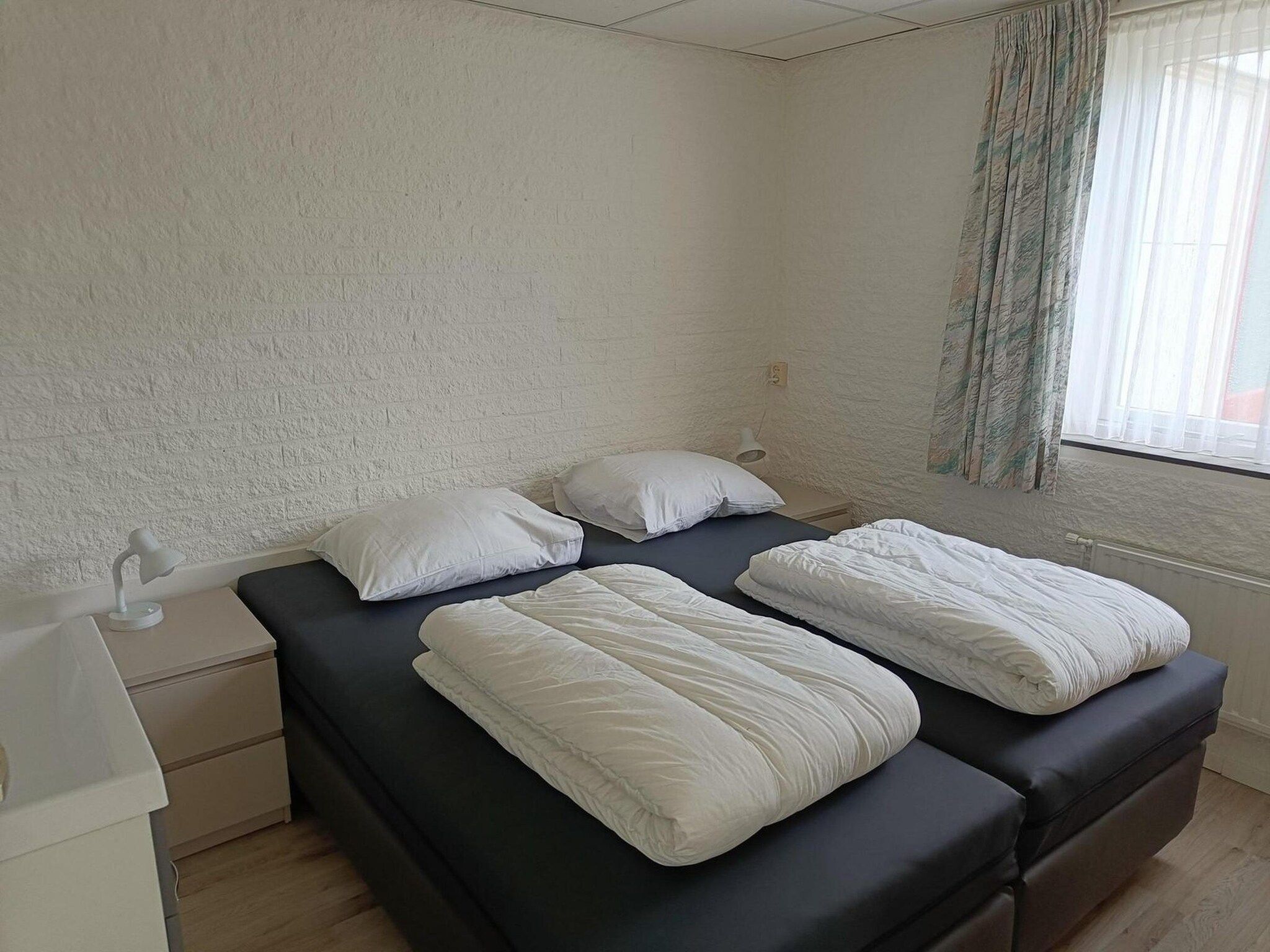 Een slaapkamer van Schoneveld 373 Strandparel Breskens in Breskens