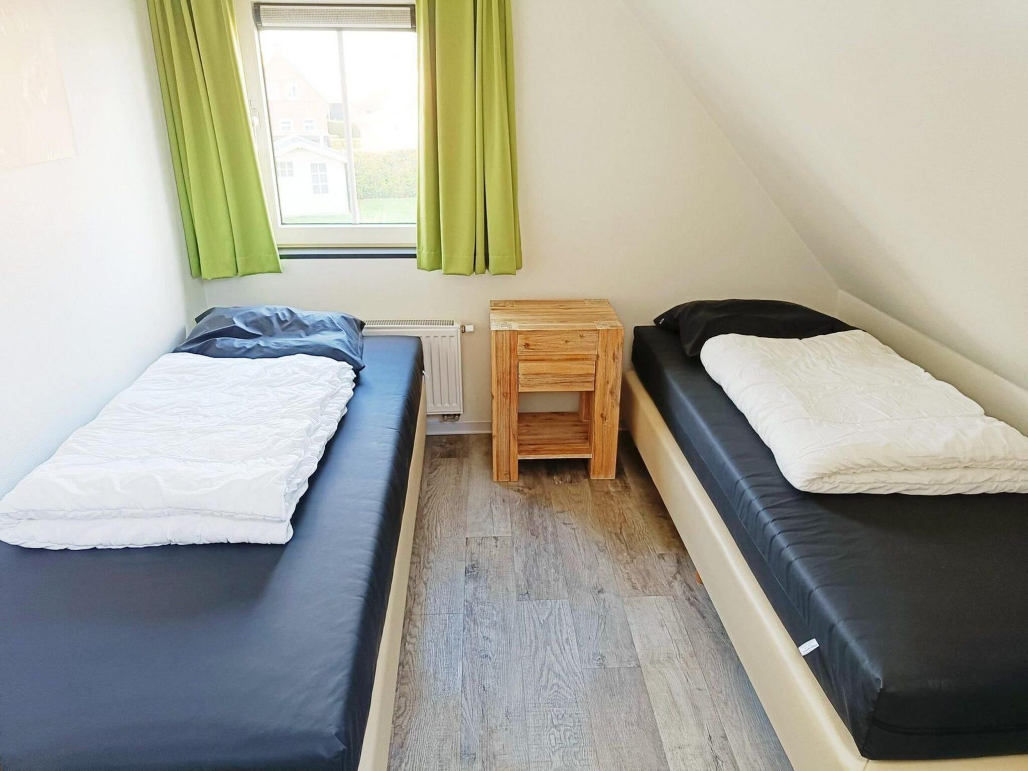 Een slaapkamer van Landgoed de Lente 12 Krokus Breskens in Breskens