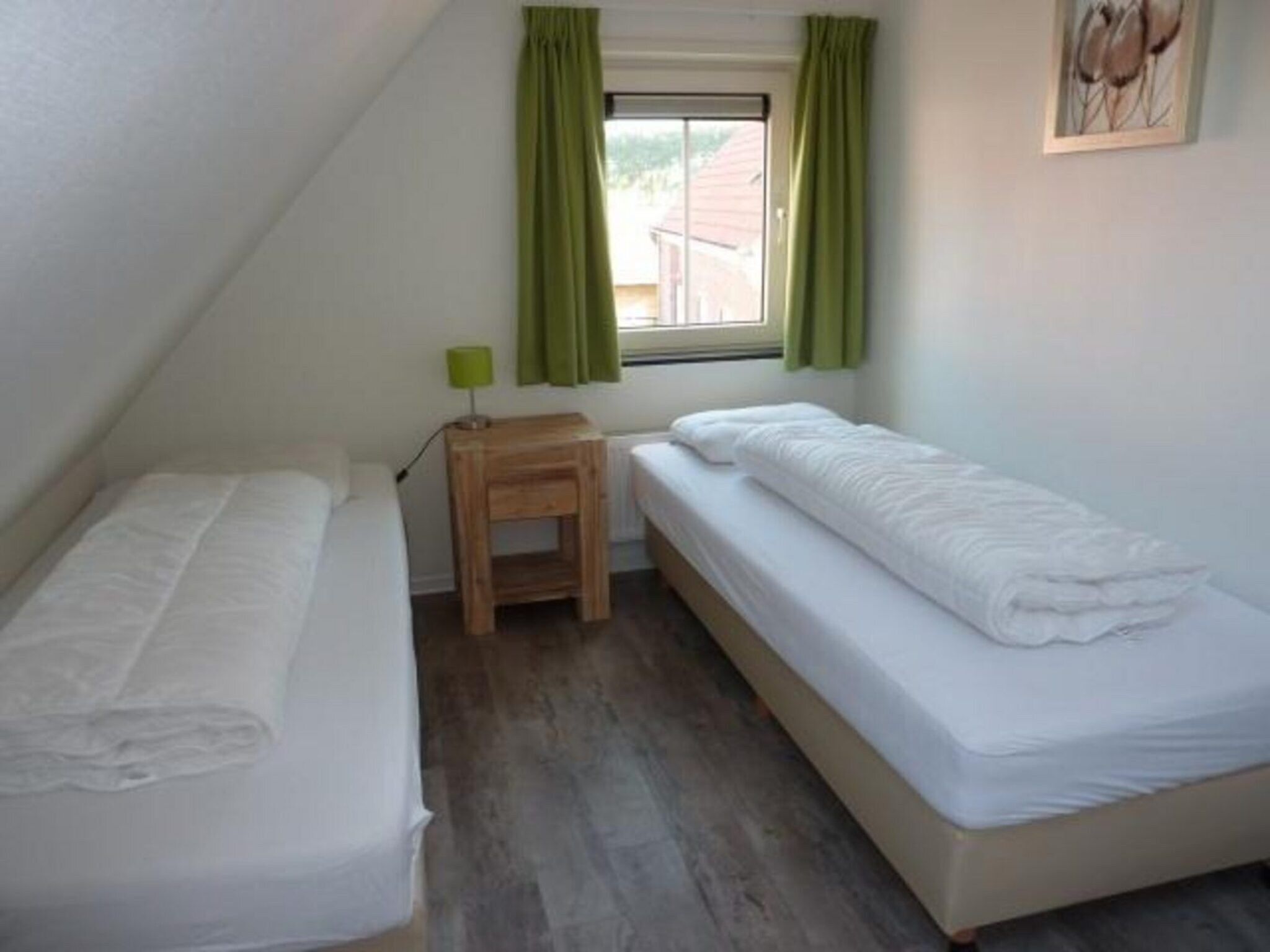 Een slaapkamer van Landgoed de Lente 36 Krokus Breskens in Breskens