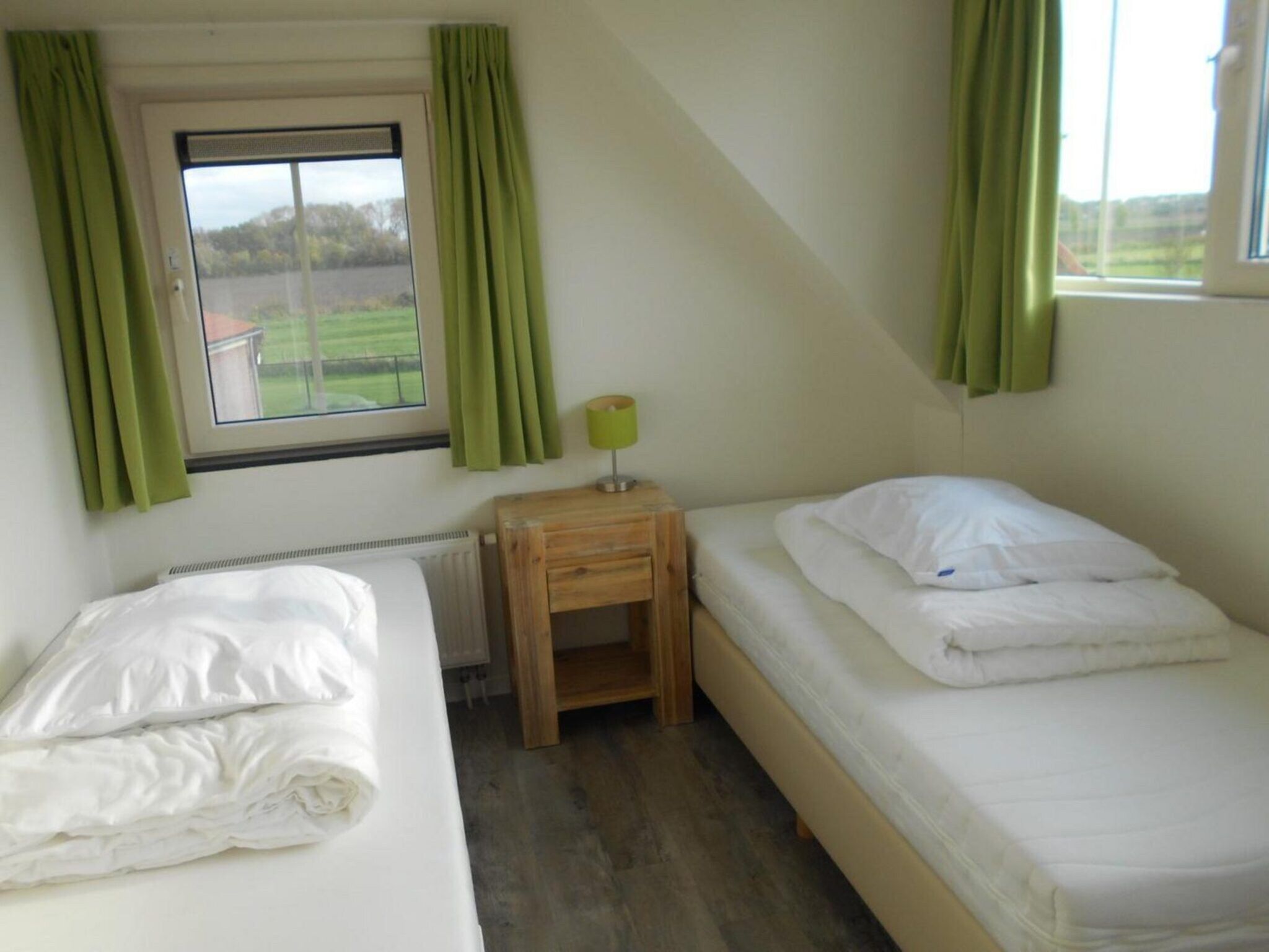 Een slaapkamer van Landgoed de Lente 36 Krokus Breskens in Breskens