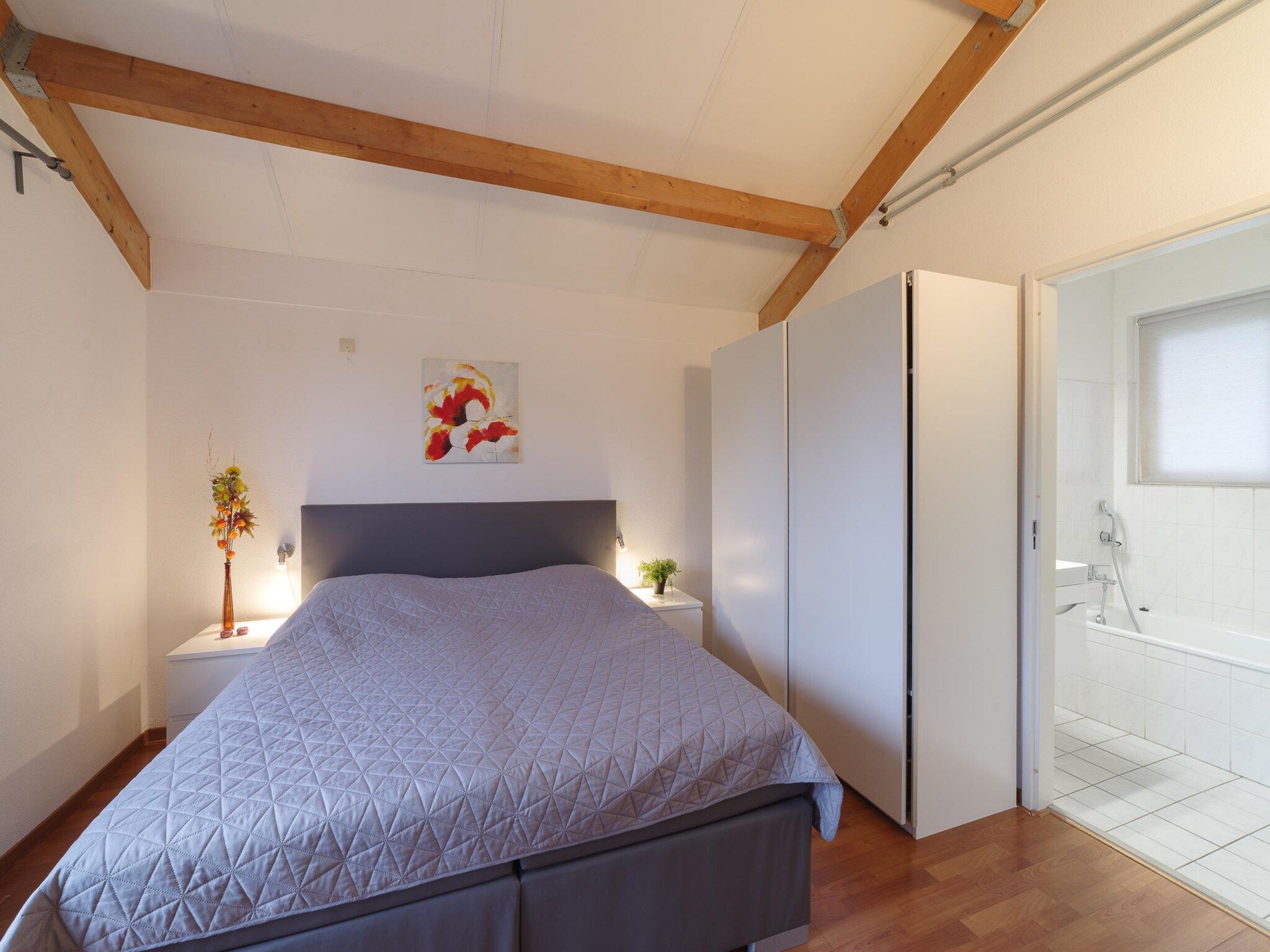 Een slaapkamer van Villapark De Oesterbaai 99 in Wemeldinge
