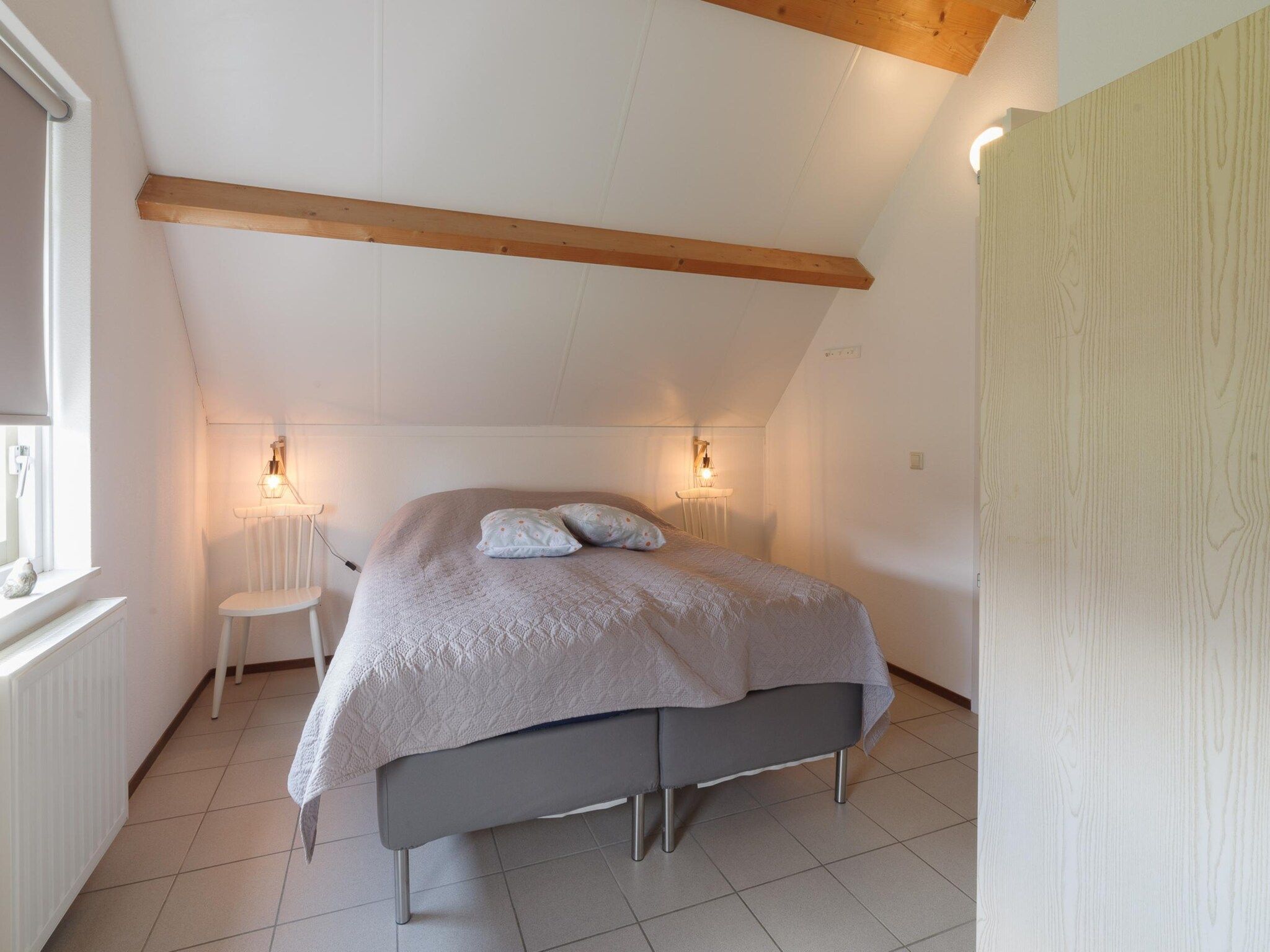 Een slaapkamer van Villapark De Oesterbaai 123 in Wemeldinge