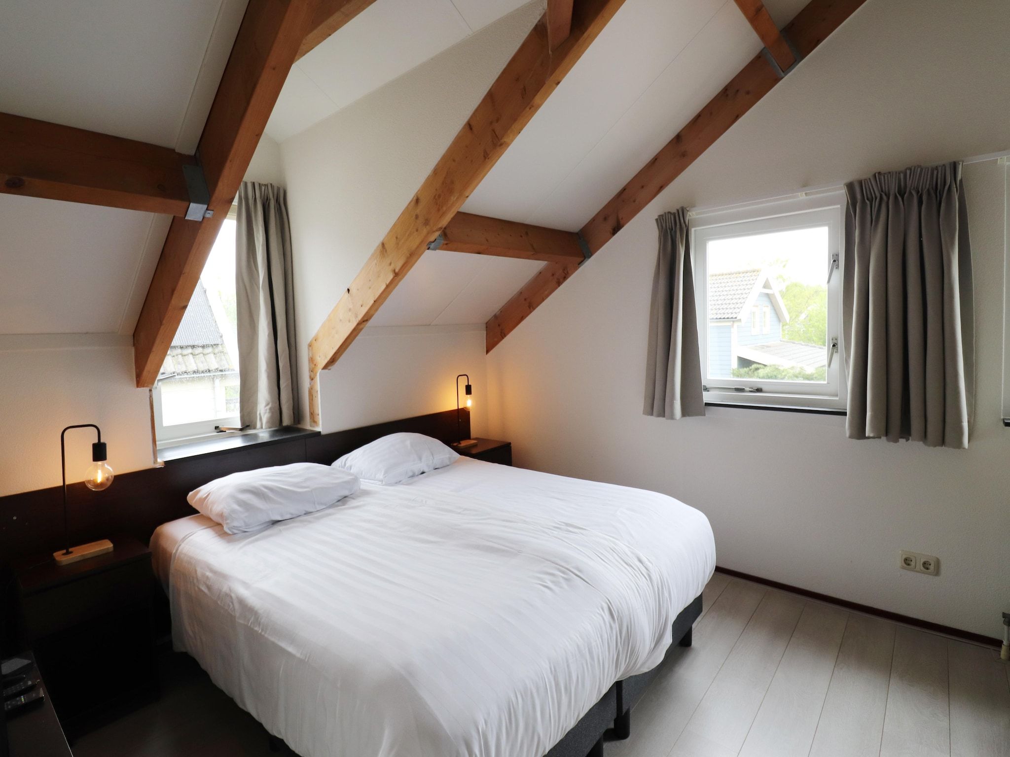 Een slaapkamer van 218 in Simonshaven