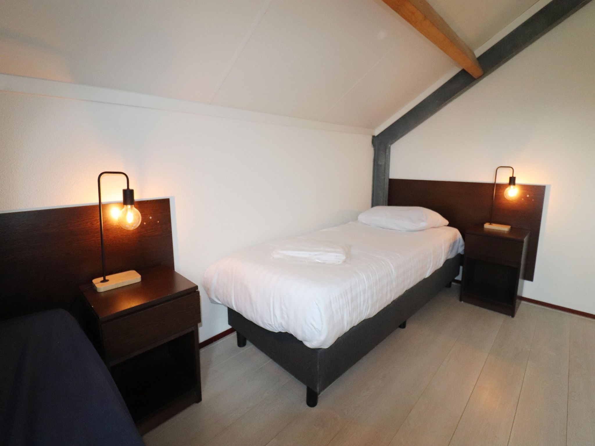 Een slaapkamer van 218 in Simonshaven