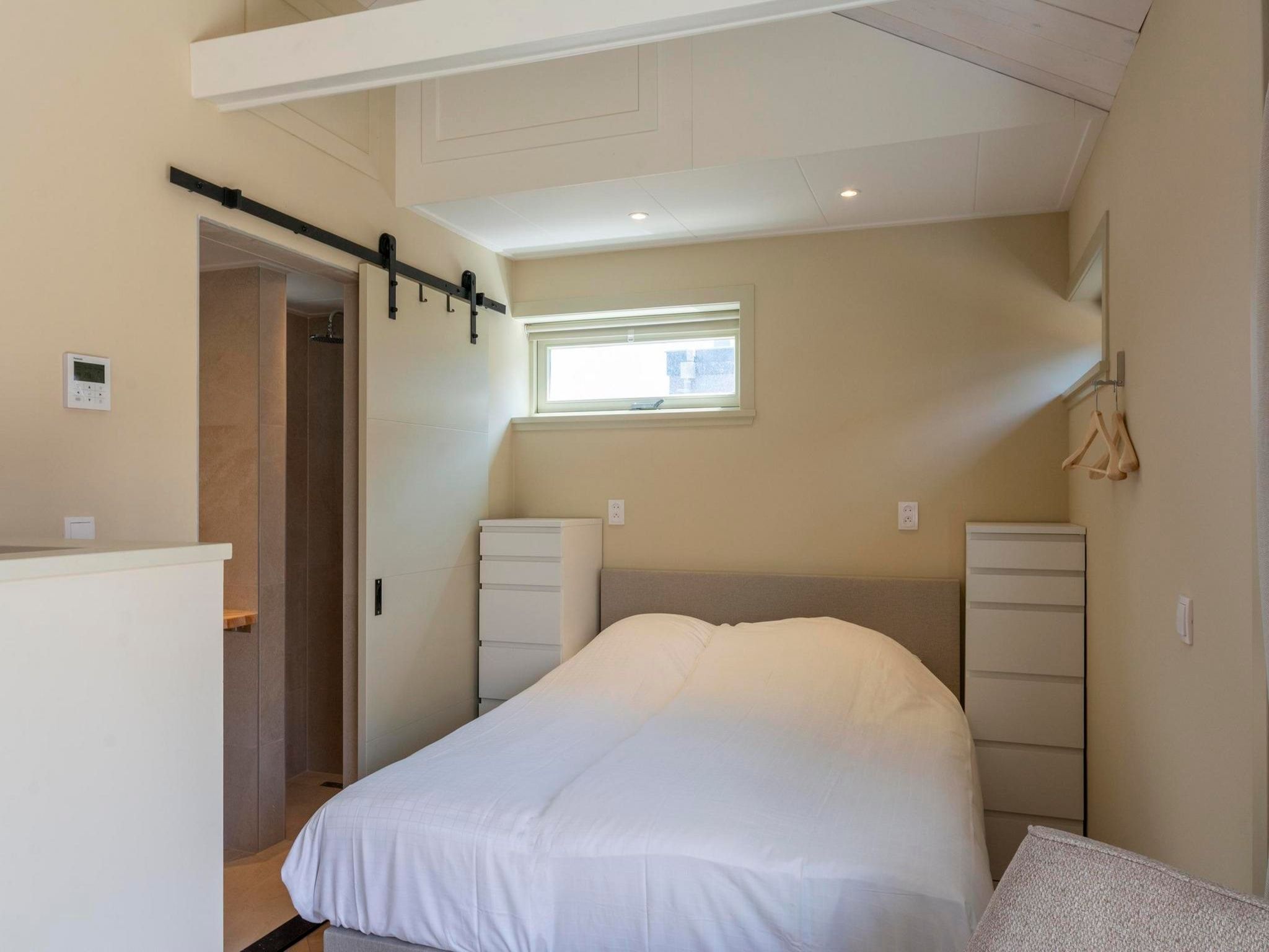 Een slaapkamer van Strandsuites 2 agendas in Callantsoog
