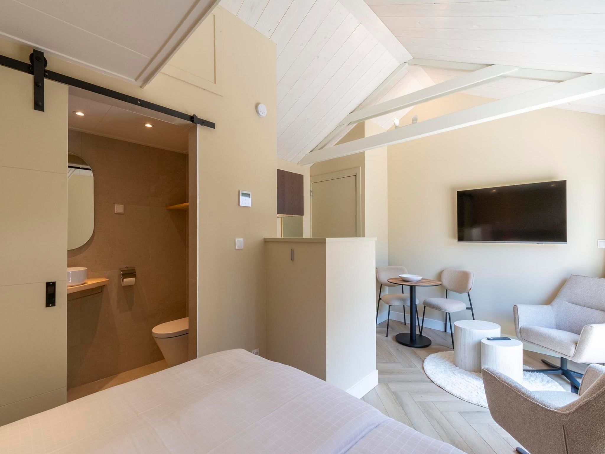Een slaapkamer van Strandsuites 2 agendas in Callantsoog