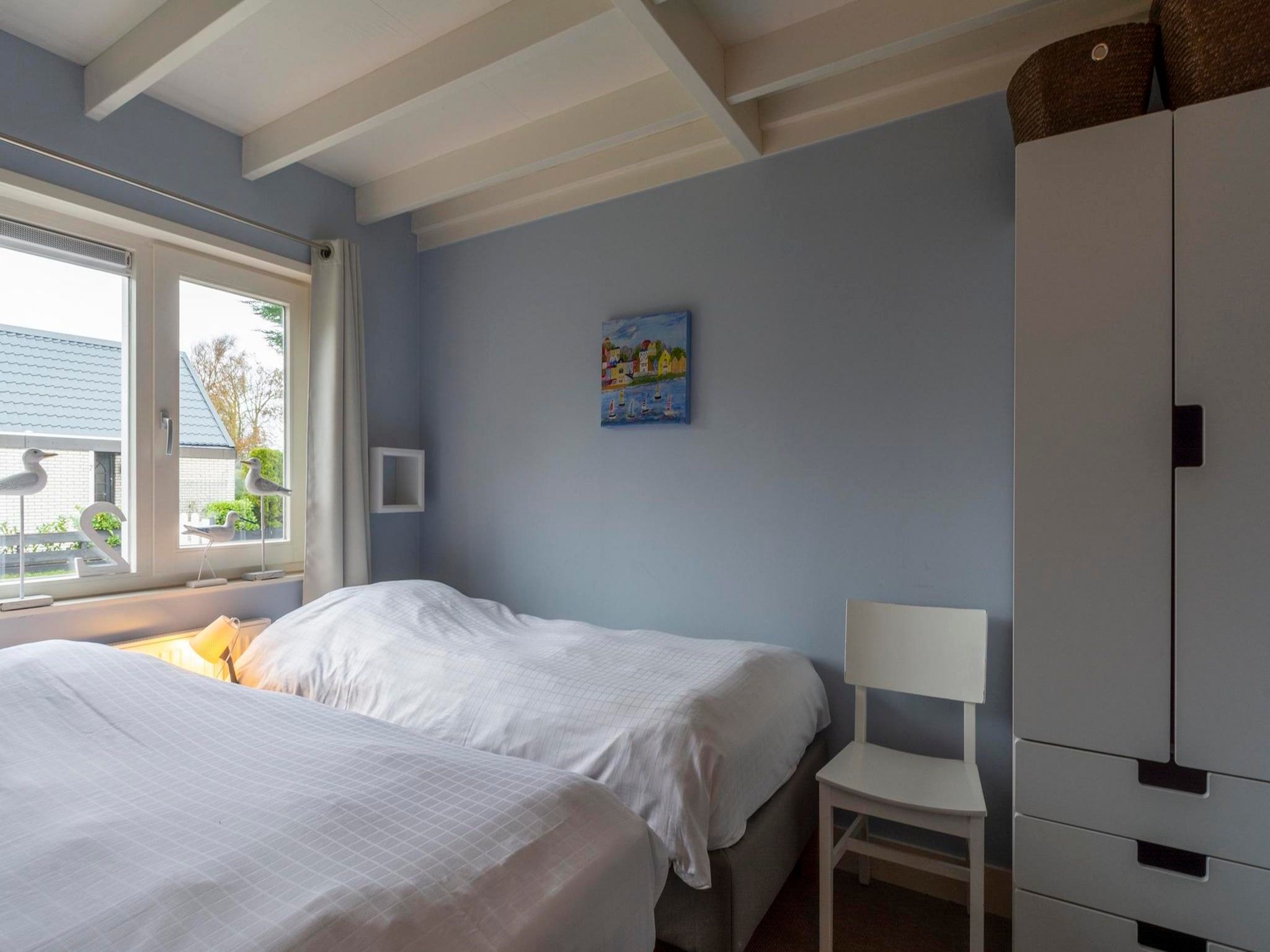 Een slaapkamer van Belkmerduinen 2 in Sint Maartenszee