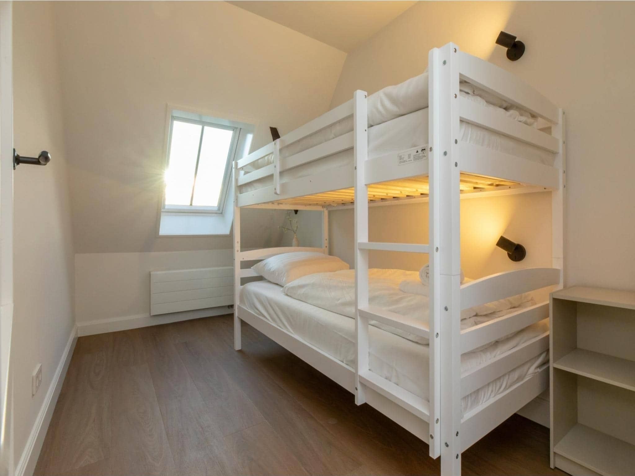 Een slaapkamer van Vakantiehuis 'Boerderij Molenhof' - Stationsweg 5  Heinkenszand in Heinkenszand