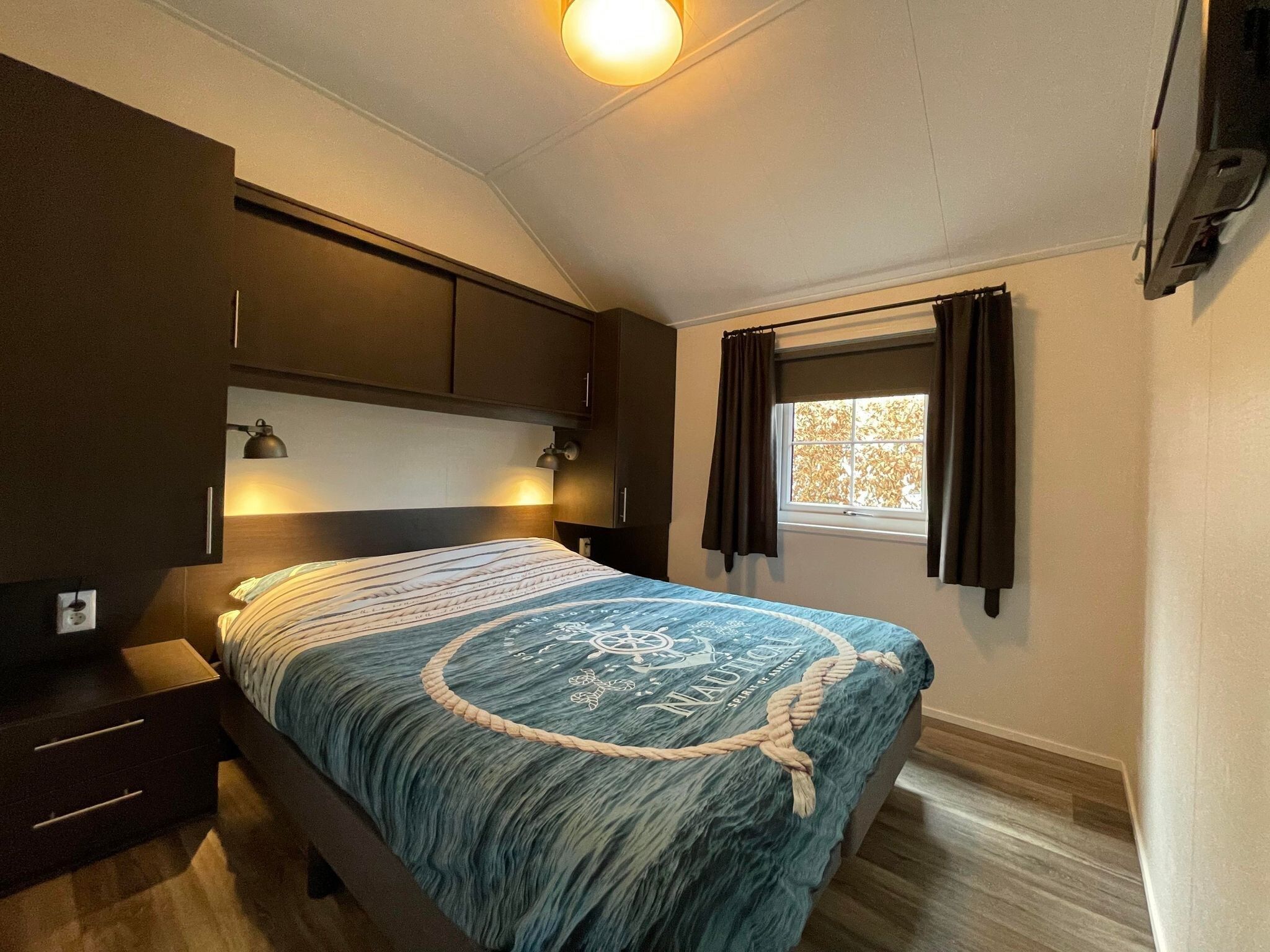 Een slaapkamer van Boerderijchalet in Sint Nicolaasga