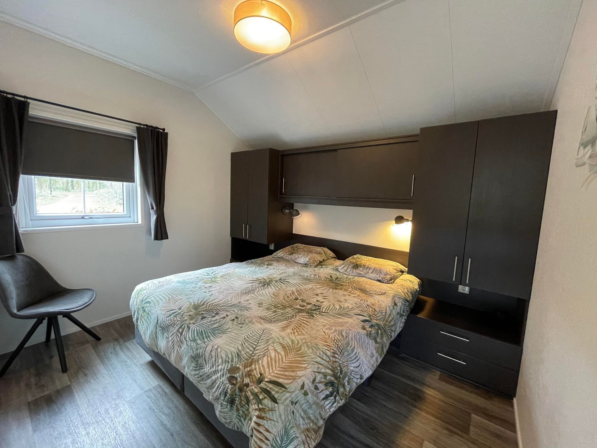 Een slaapkamer van Boerderijchalet in Sint Nicolaasga