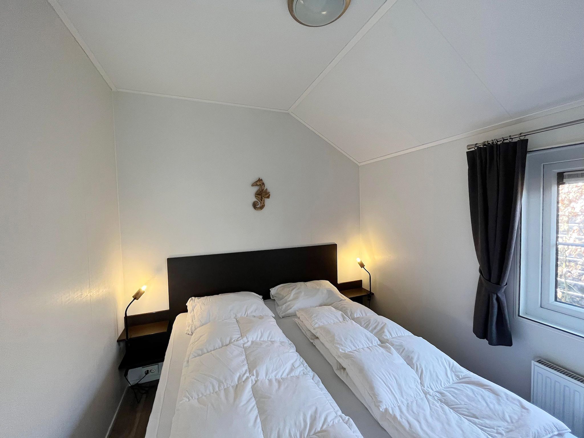 Een slaapkamer van Boerderijchalet in Sint Nicolaasga