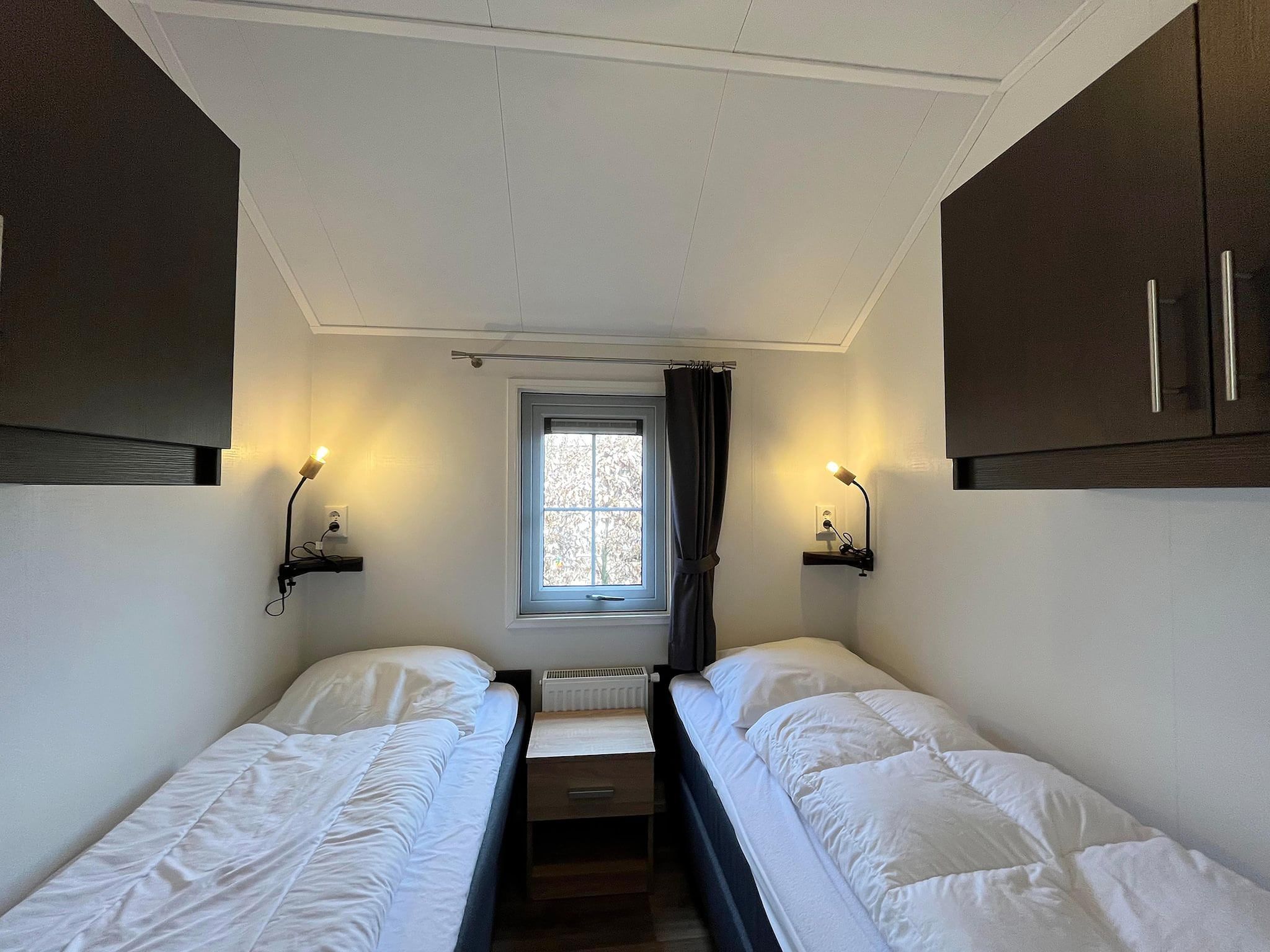 Een slaapkamer van Boerderijchalet in Sint Nicolaasga
