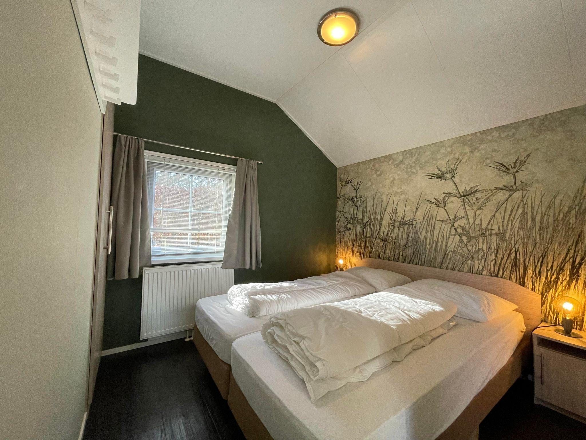Een slaapkamer van Boerderijchalet in Sint Nicolaasga
