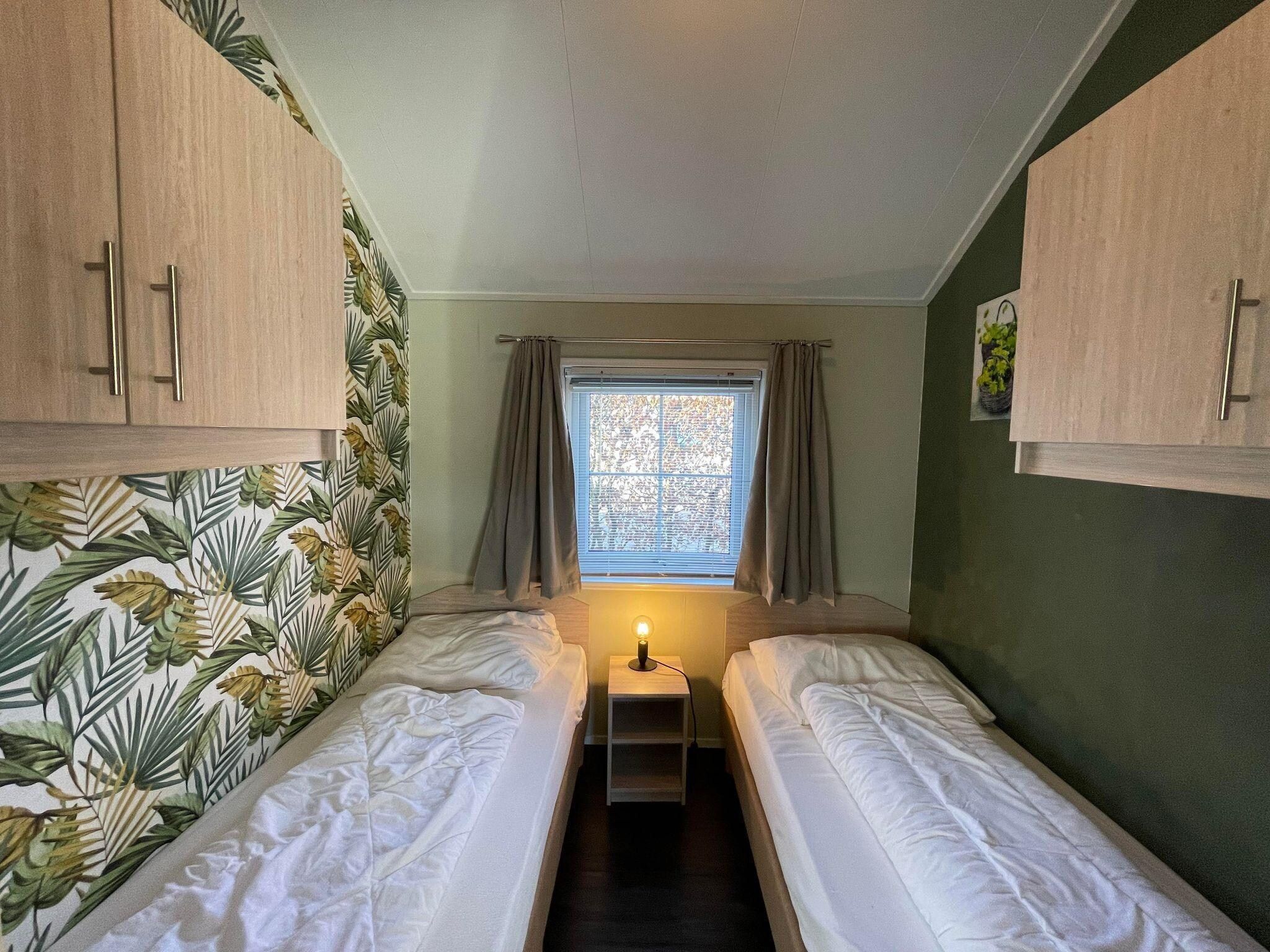 Een slaapkamer van Boerderijchalet in Sint Nicolaasga