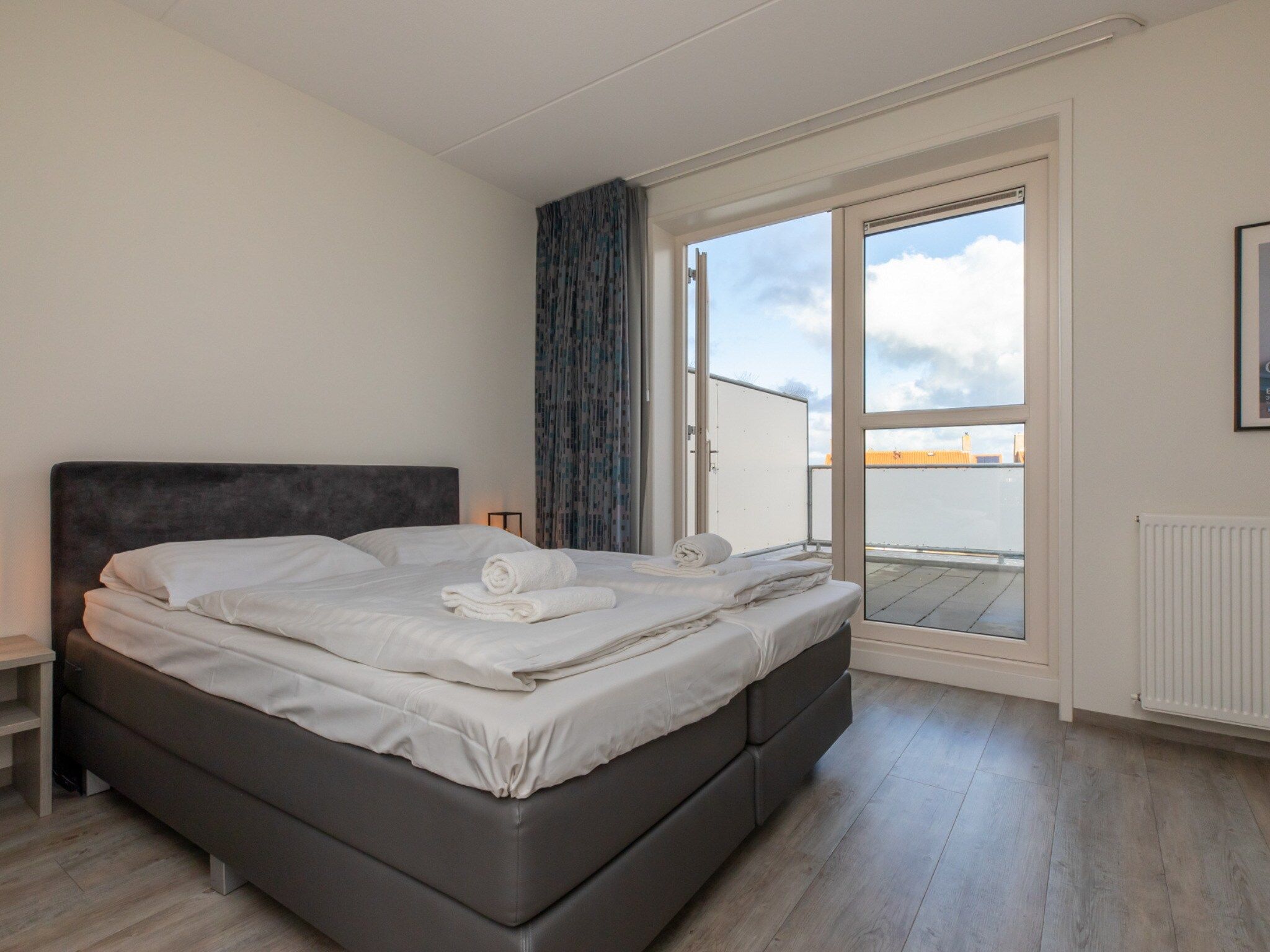 Een slaapkamer van Vakantiewoning 't Zoete Licht Residenz - Willibrordusplein 28 C  Zoutelande in Zoutelande