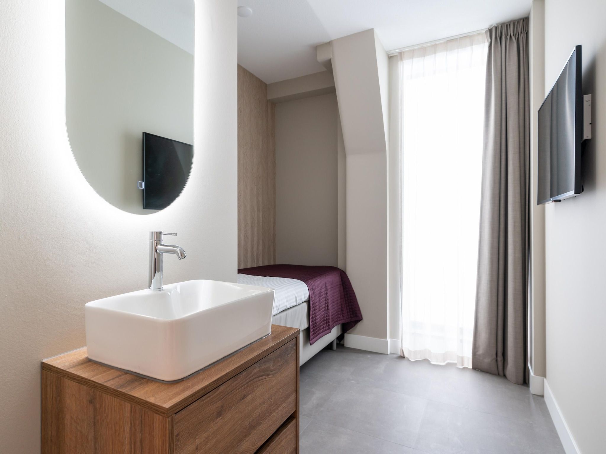 Een slaapkamer van Walden 7 in Den Haag