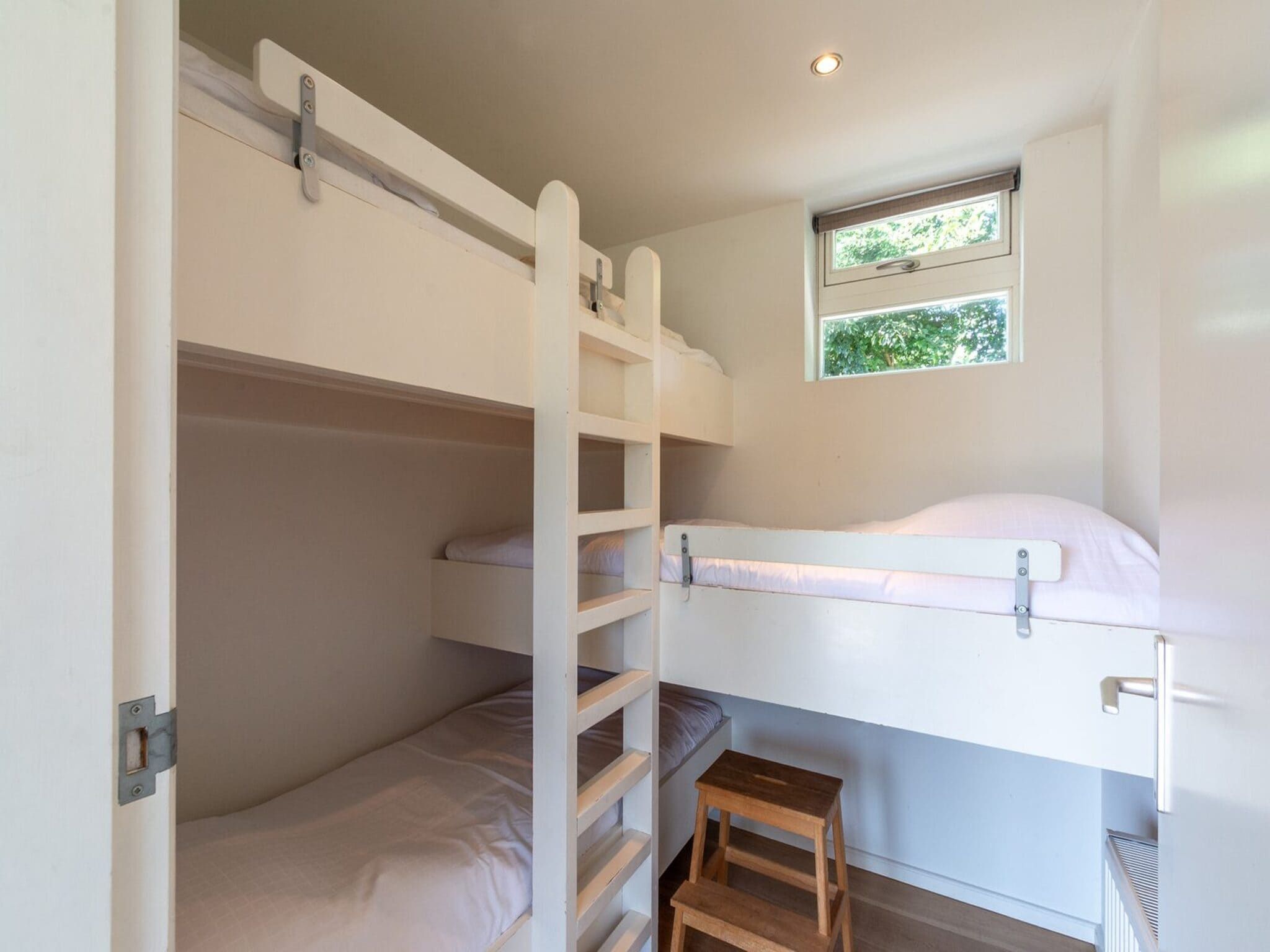 Een slaapkamer van Garnekuul 73 in Callantsoog