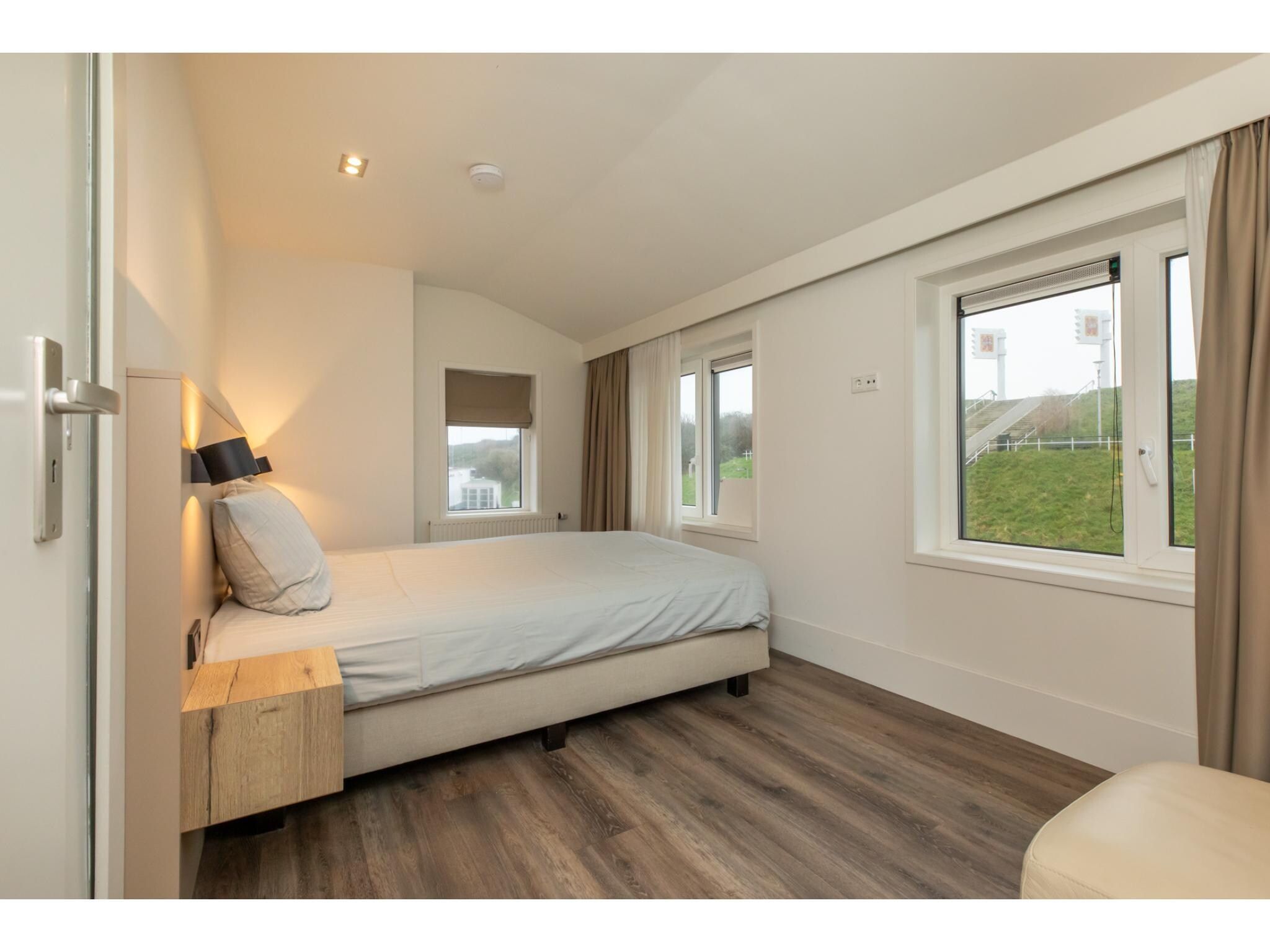 Een slaapkamer van Langstraat 5B in Zoutelande